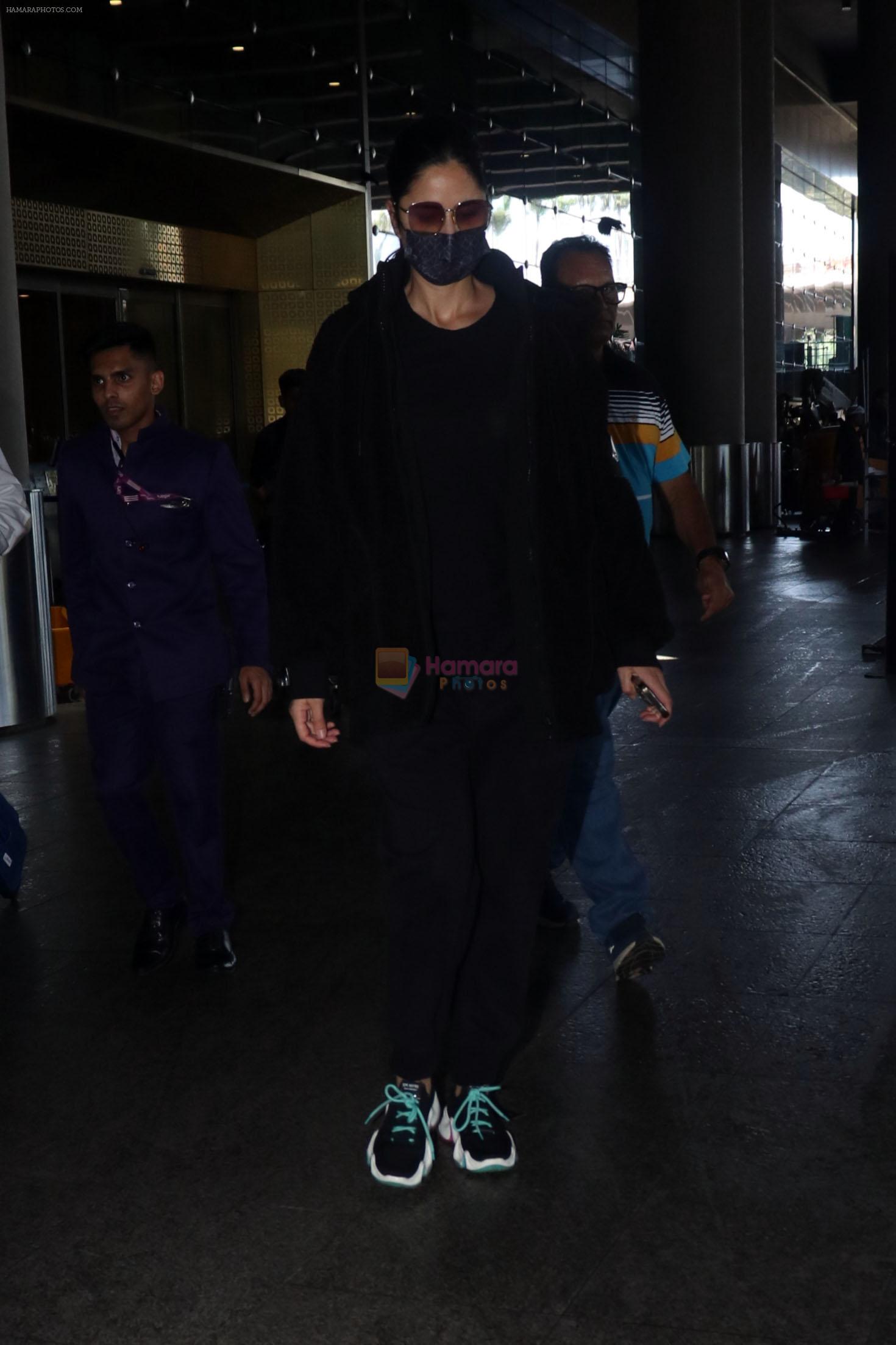Katrina Kaif, dressed in black and wearing sunglasses and a mask, seen sporting Nike shoes