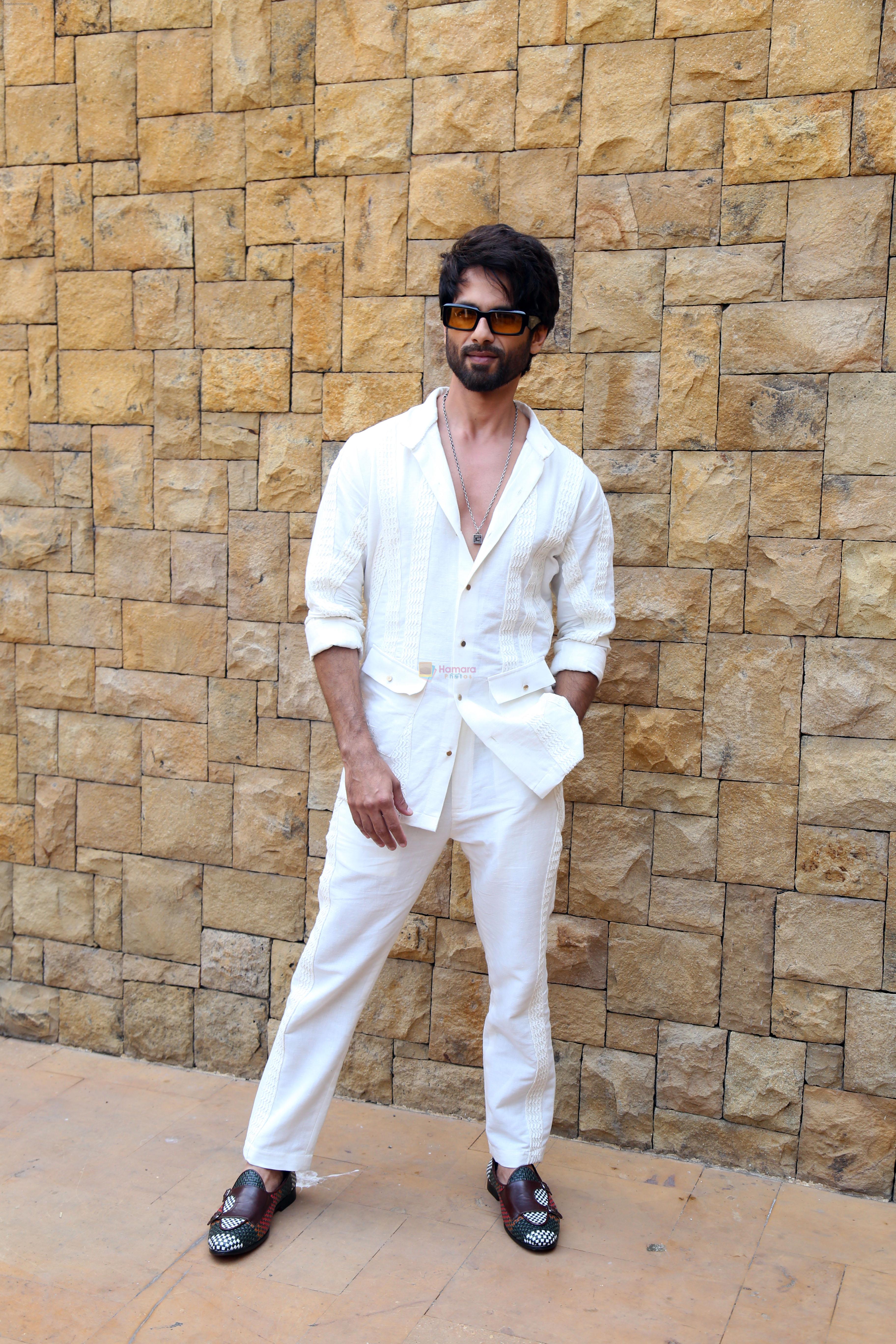 Shahid Kapoor dressed in white shirt and pant and sunglasses promoting his film Bloody Daddy