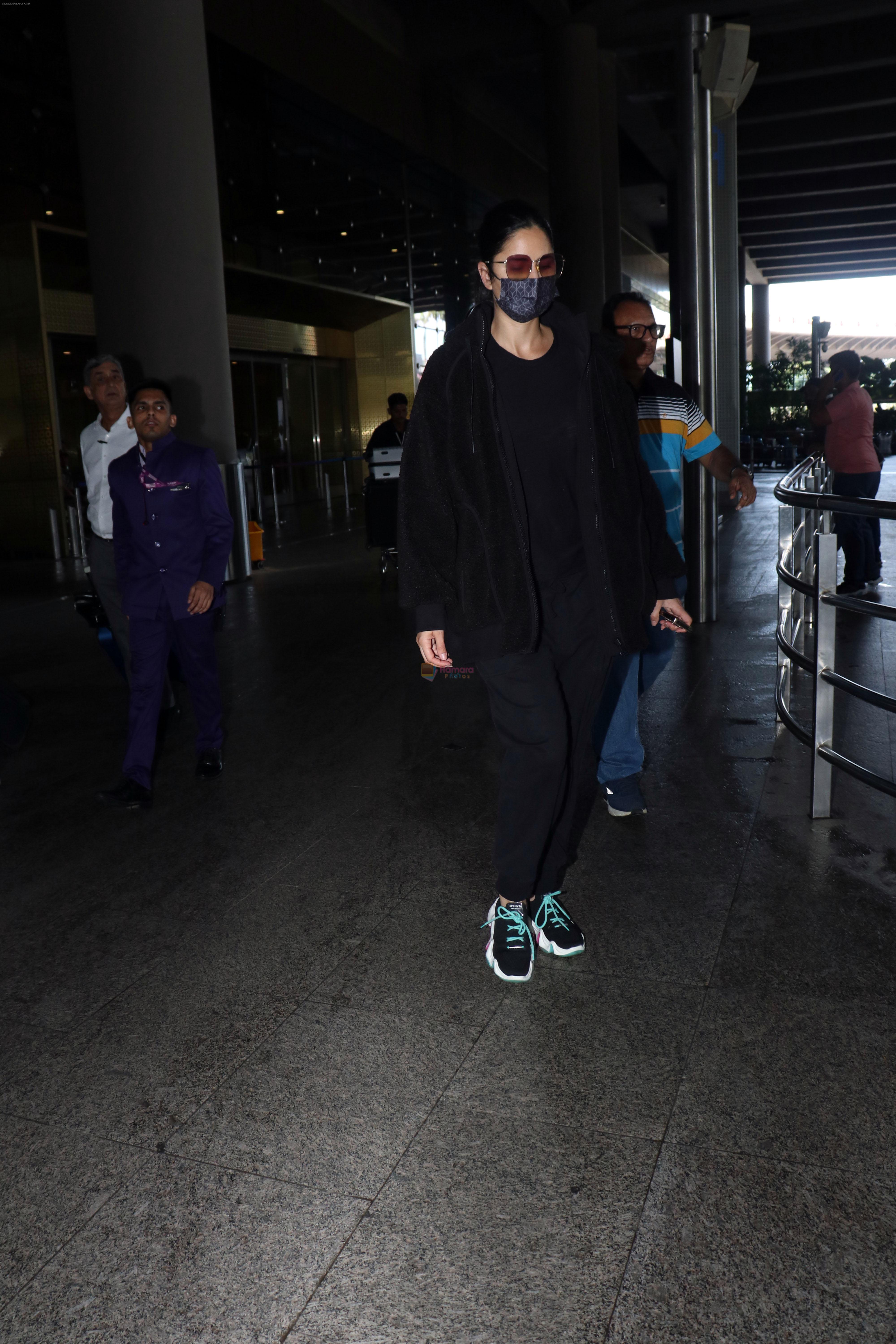 Katrina Kaif, dressed in black and wearing sunglasses and a mask, seen sporting Nike shoes