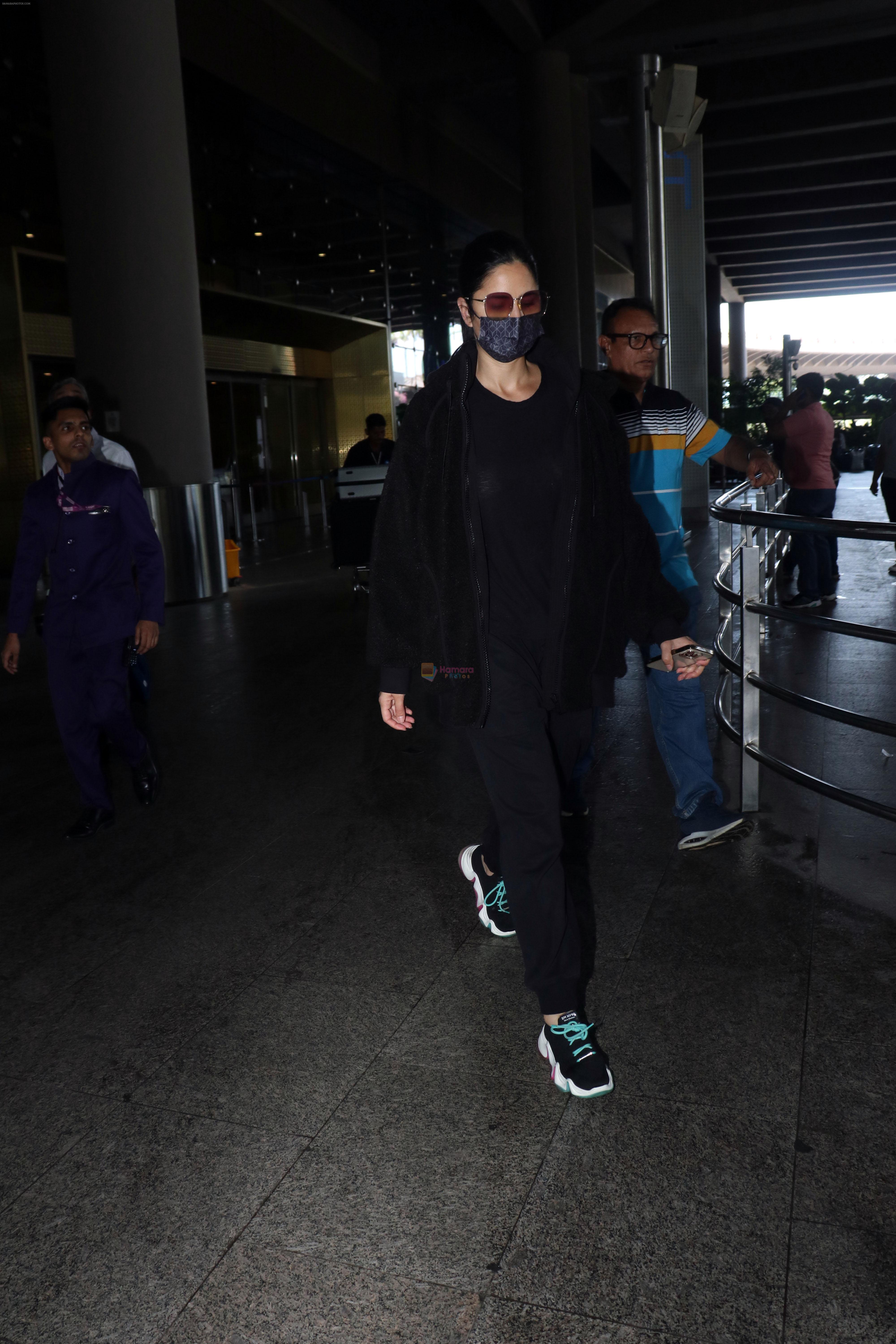 Katrina Kaif, dressed in black and wearing sunglasses and a mask, seen sporting Nike shoes