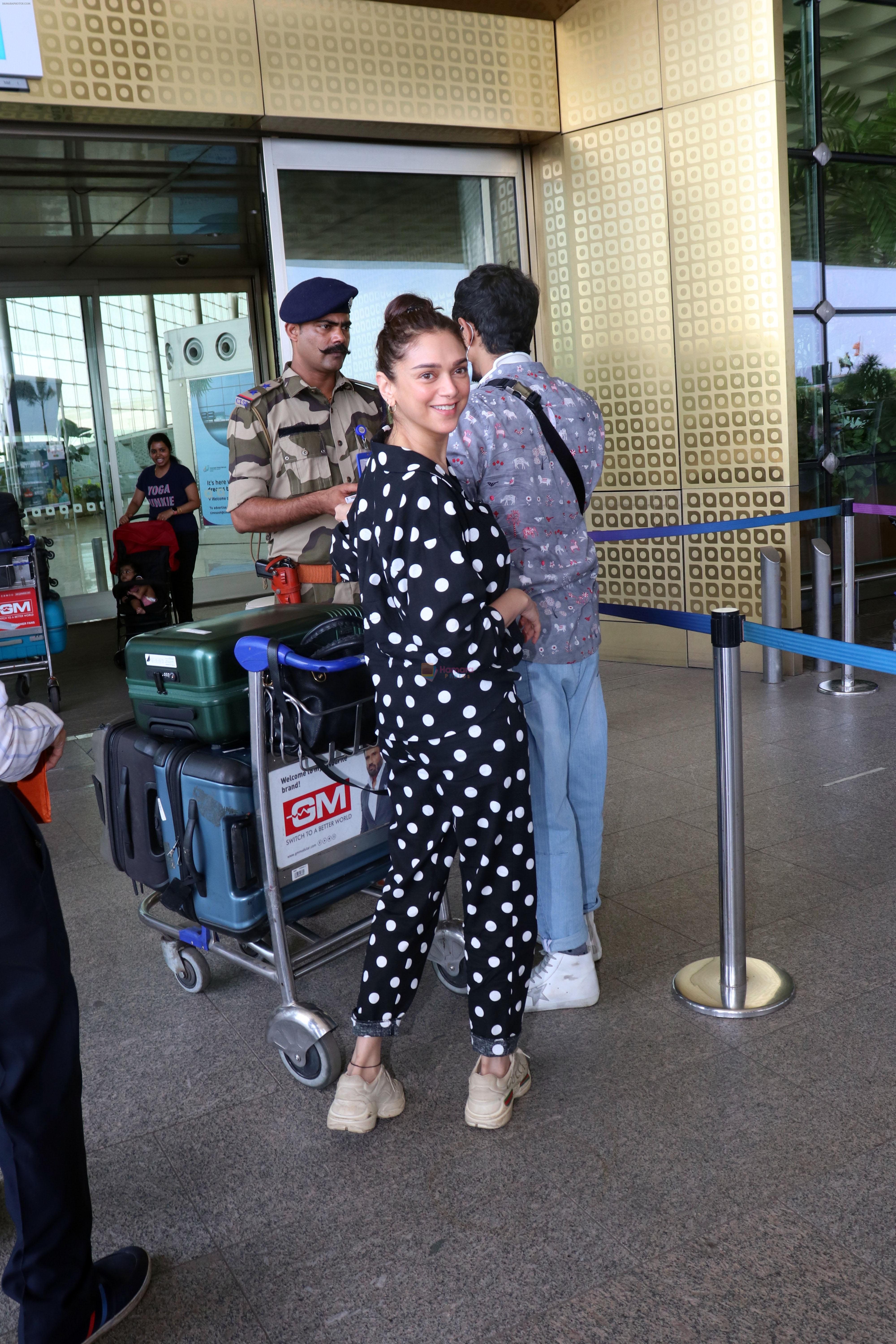 Aditi Rao Hydari holding black leather Balenciaga handbag wearing Polka Dots Richie Freeman outfit and Gucci Leather sneakers