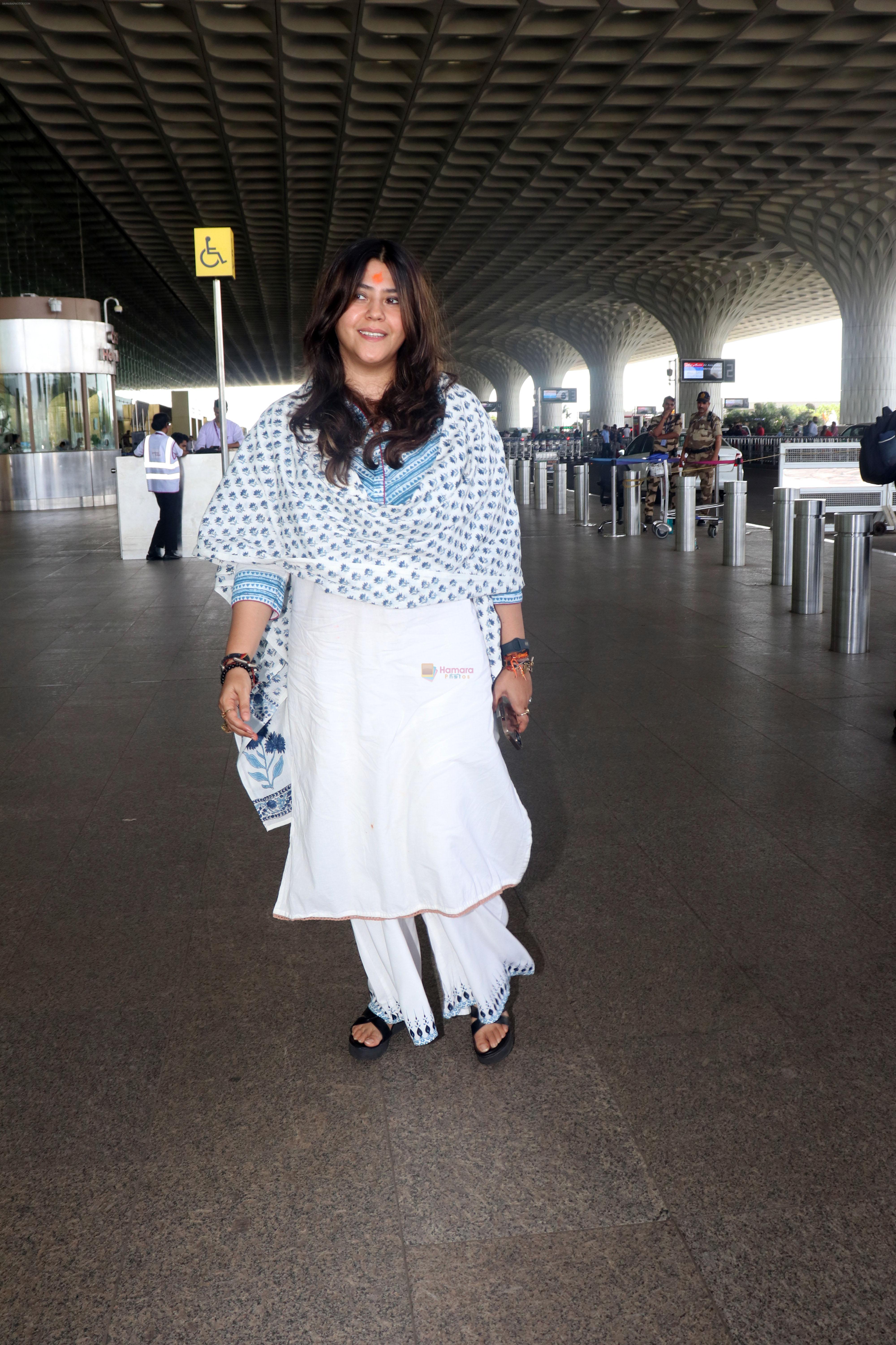 Ekta Kapoor in a white chudidar along with a Christian Dior Tote Blue Dior Oblique Embroidery purse