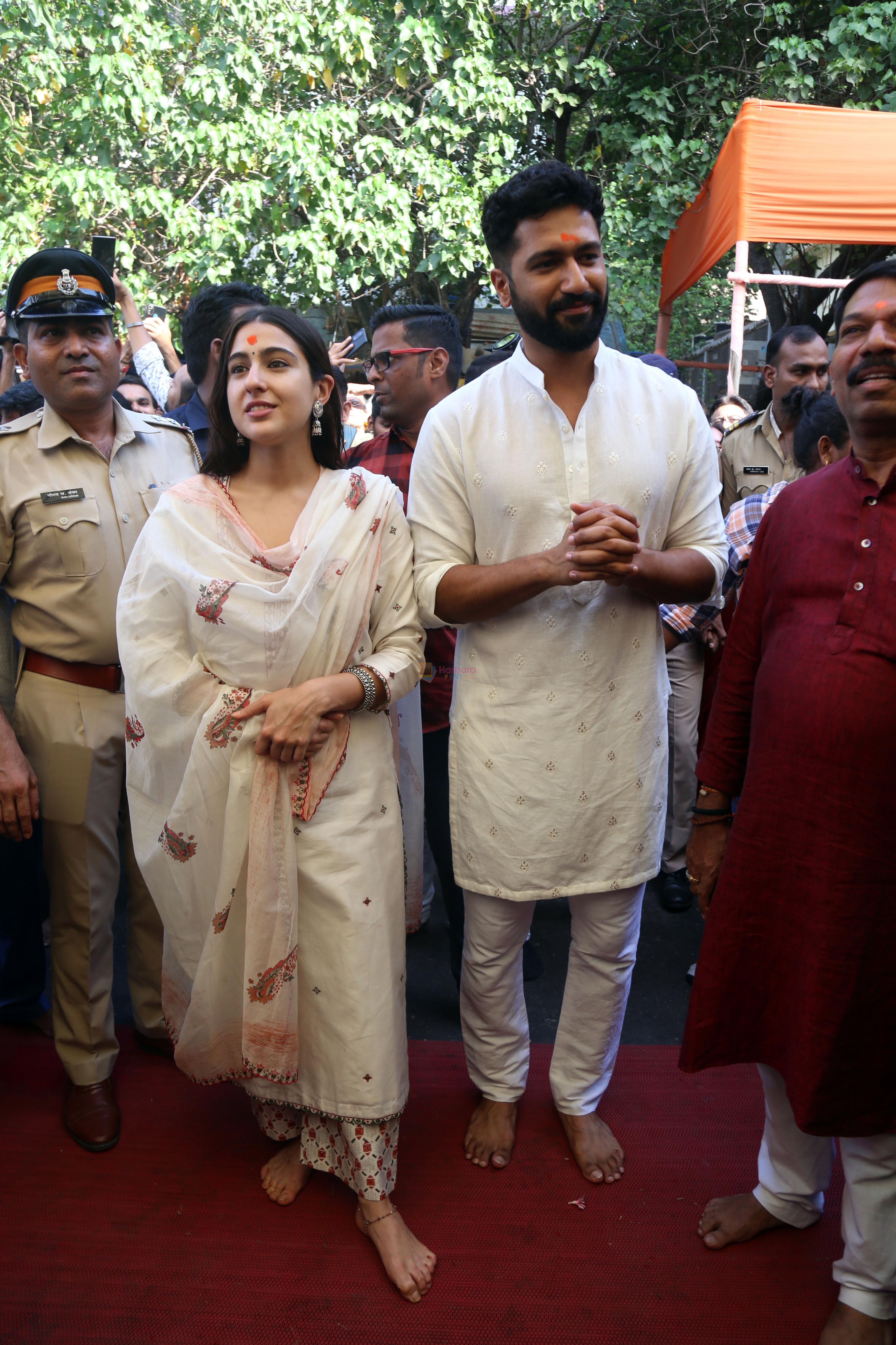 Vicky Kaushal And Sara Ali Khan distribute sweet packets at Shree Siddhivinayak Ganapati Mandir and seek blessings for their movie Zara Hatke Zara Bachke