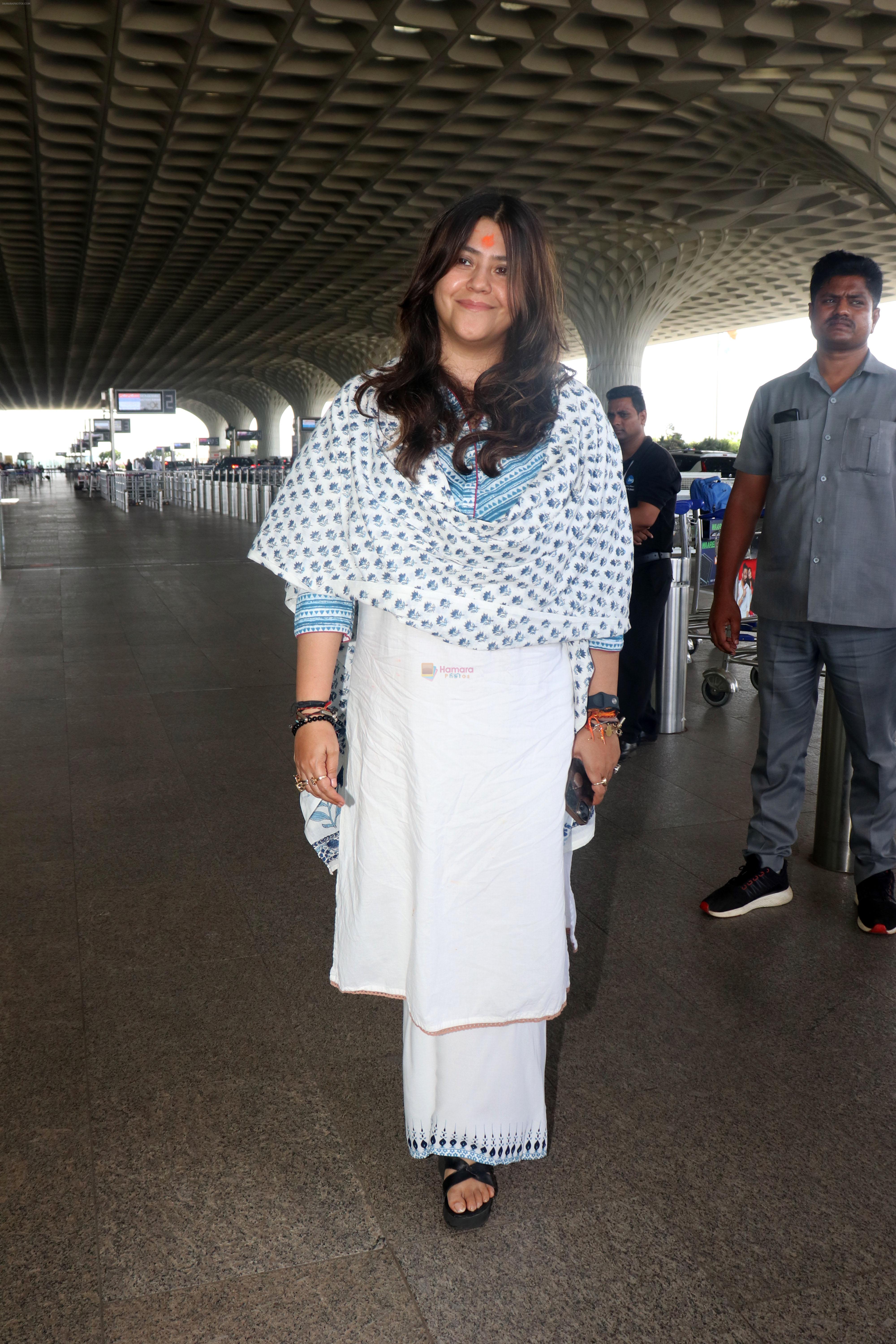 Ekta Kapoor in a white chudidar along with a Christian Dior Tote Blue Dior Oblique Embroidery purse