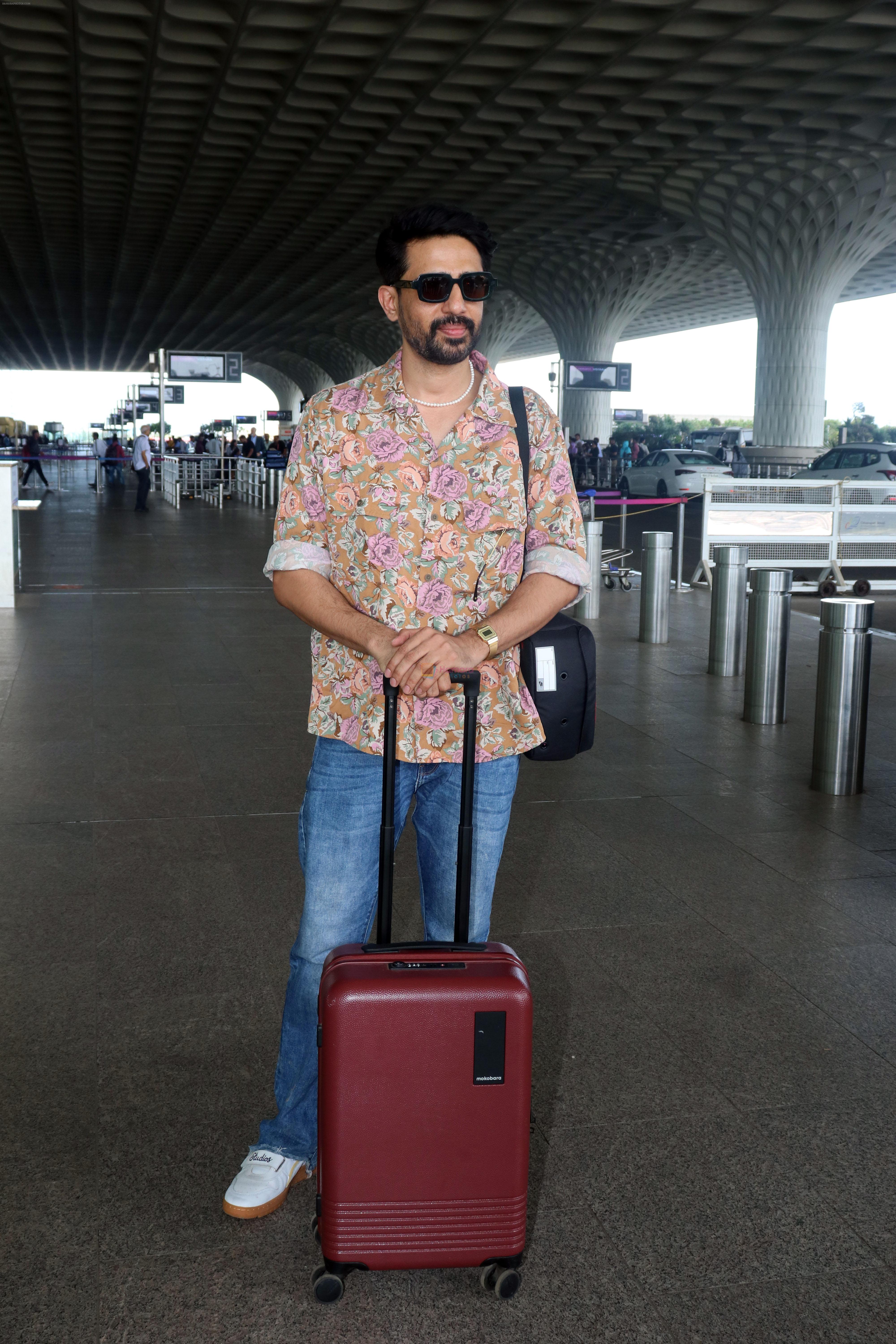Gulshan Devaiah in a flowery shirt and jeans pant