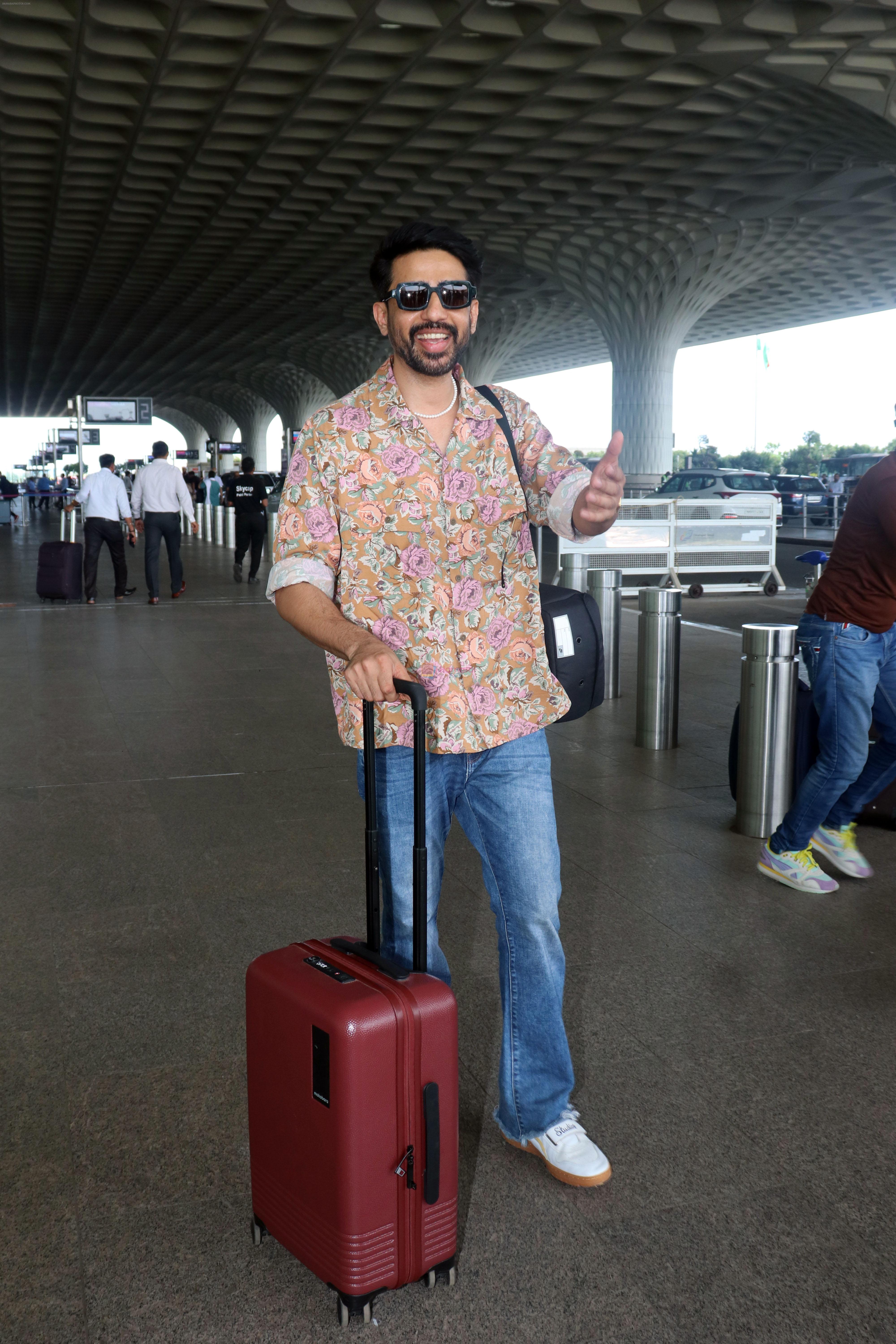 Gulshan Devaiah in a flowery shirt and jeans pant