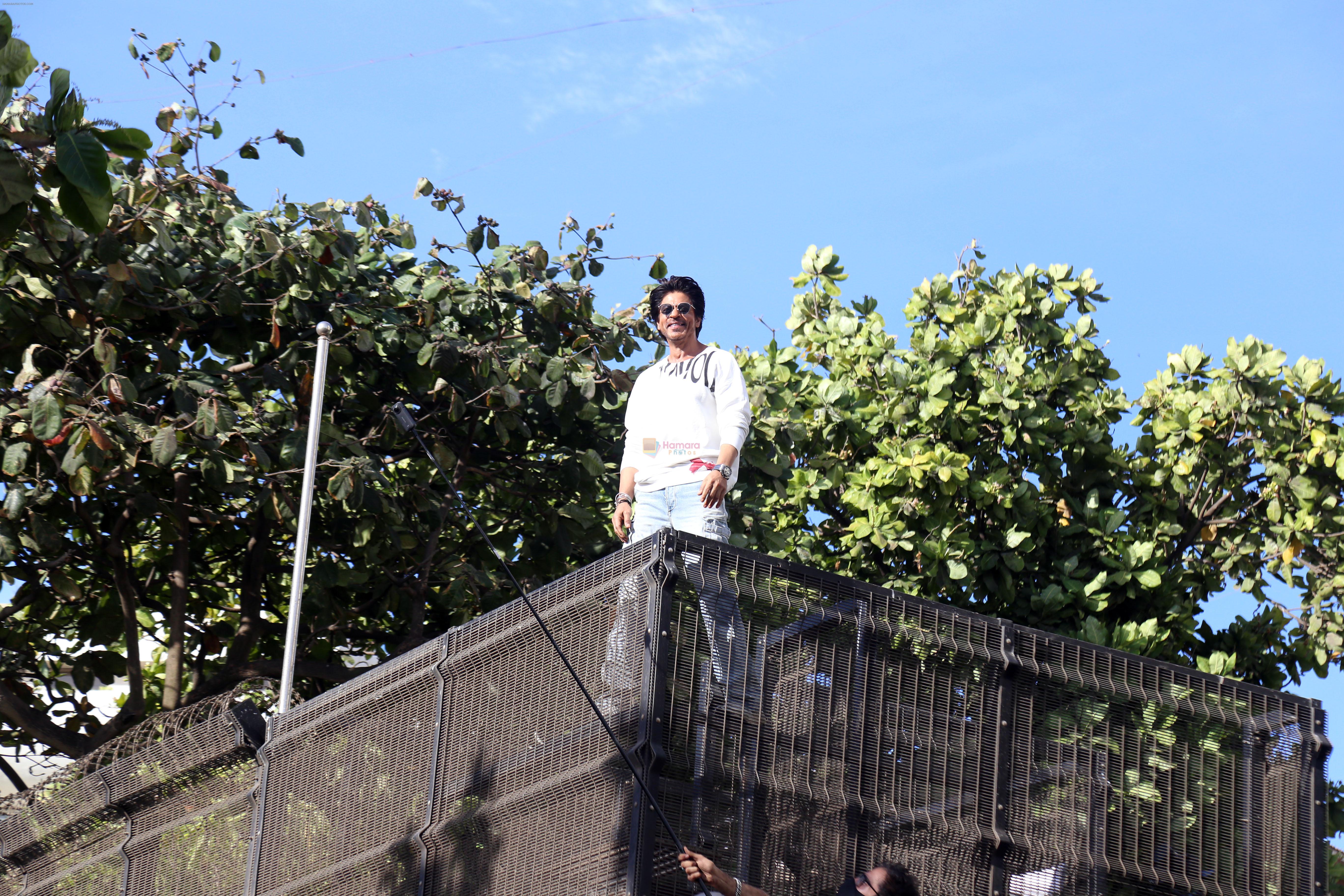 Shah Rukh Khan pose in celebration of the world TV premiere of his film Pathan