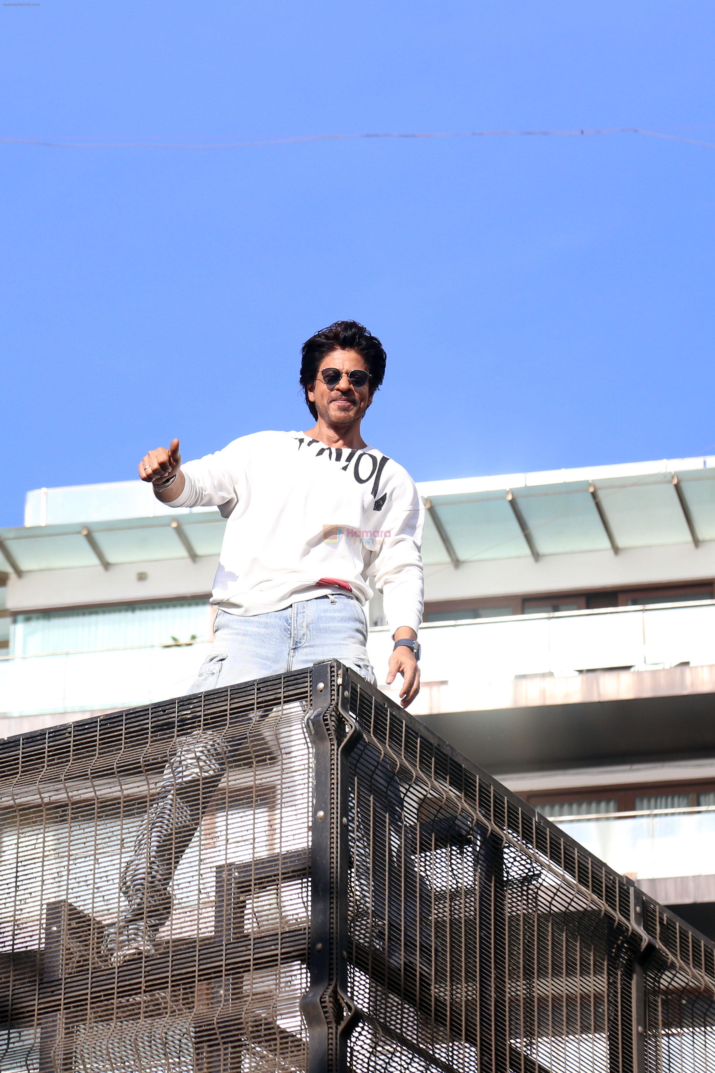 Shah Rukh Khan pose in celebration of the world TV premiere of his film Pathan