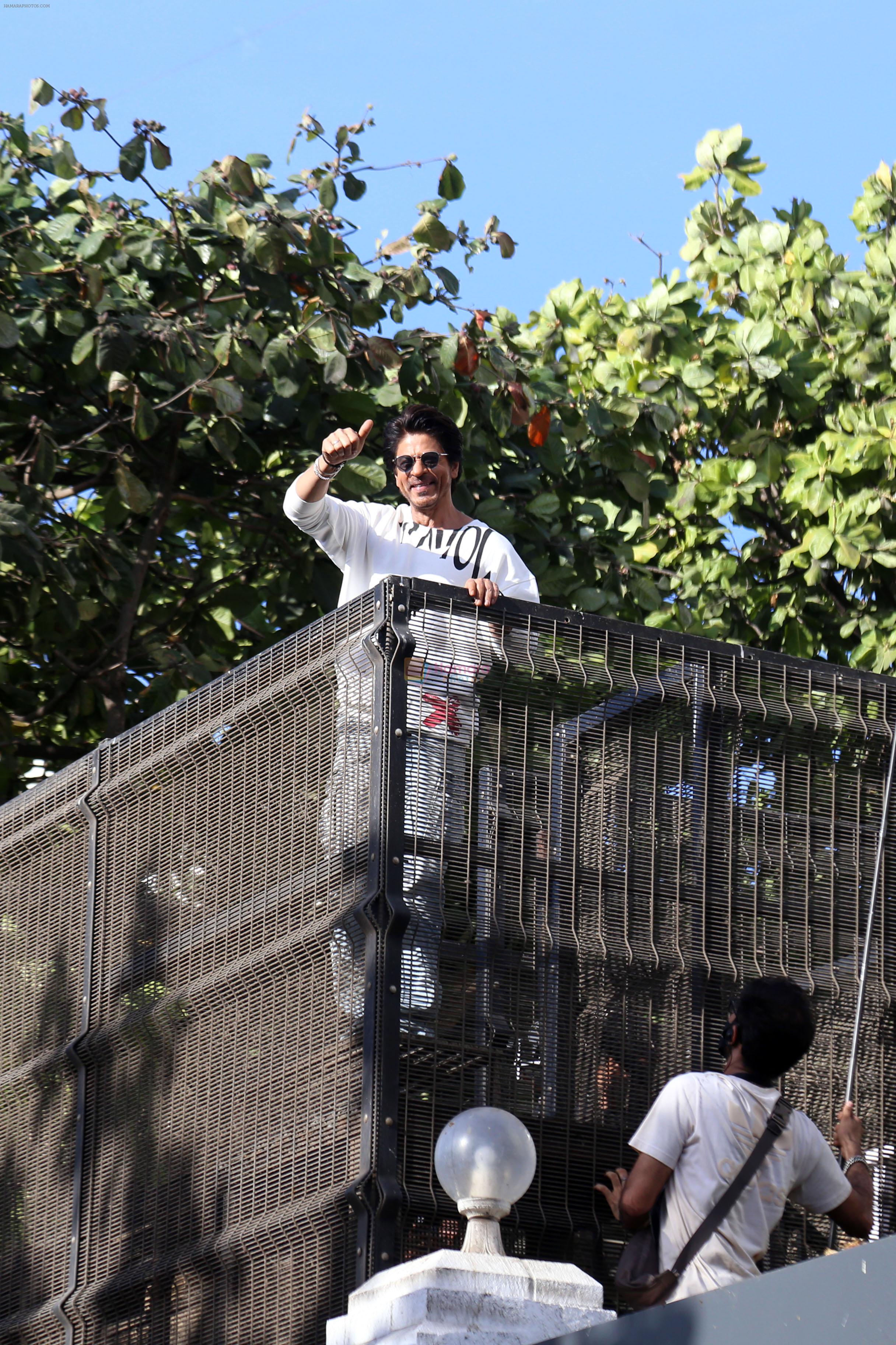 Shah Rukh Khan pose in celebration of the world TV premiere of his film Pathan