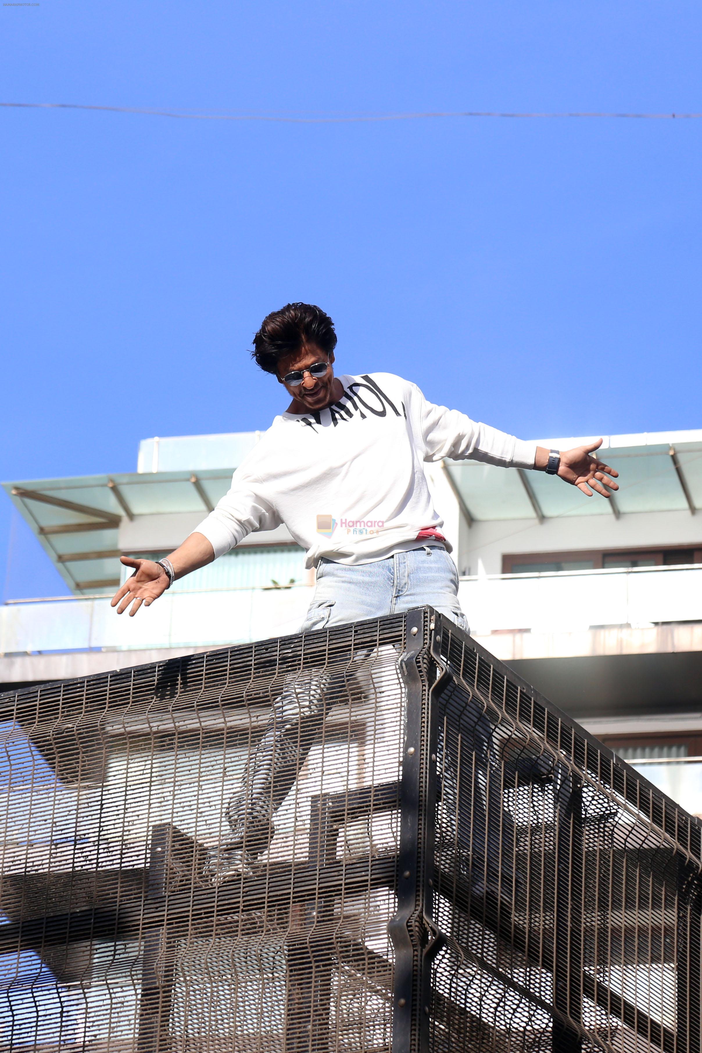 Shah Rukh Khan pose in celebration of the world TV premiere of his film Pathan