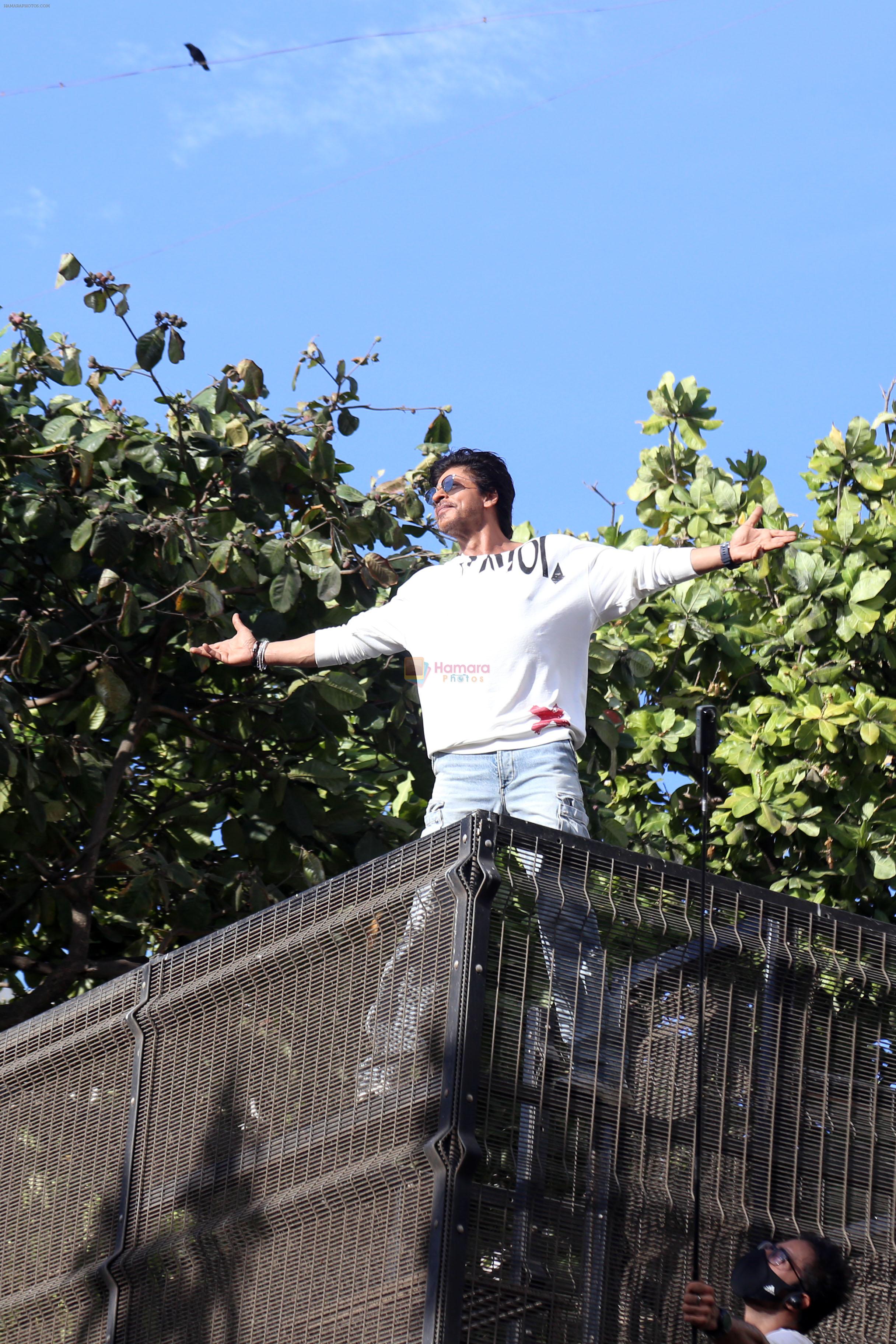 Shah Rukh Khan pose in celebration of the world TV premiere of his film Pathan