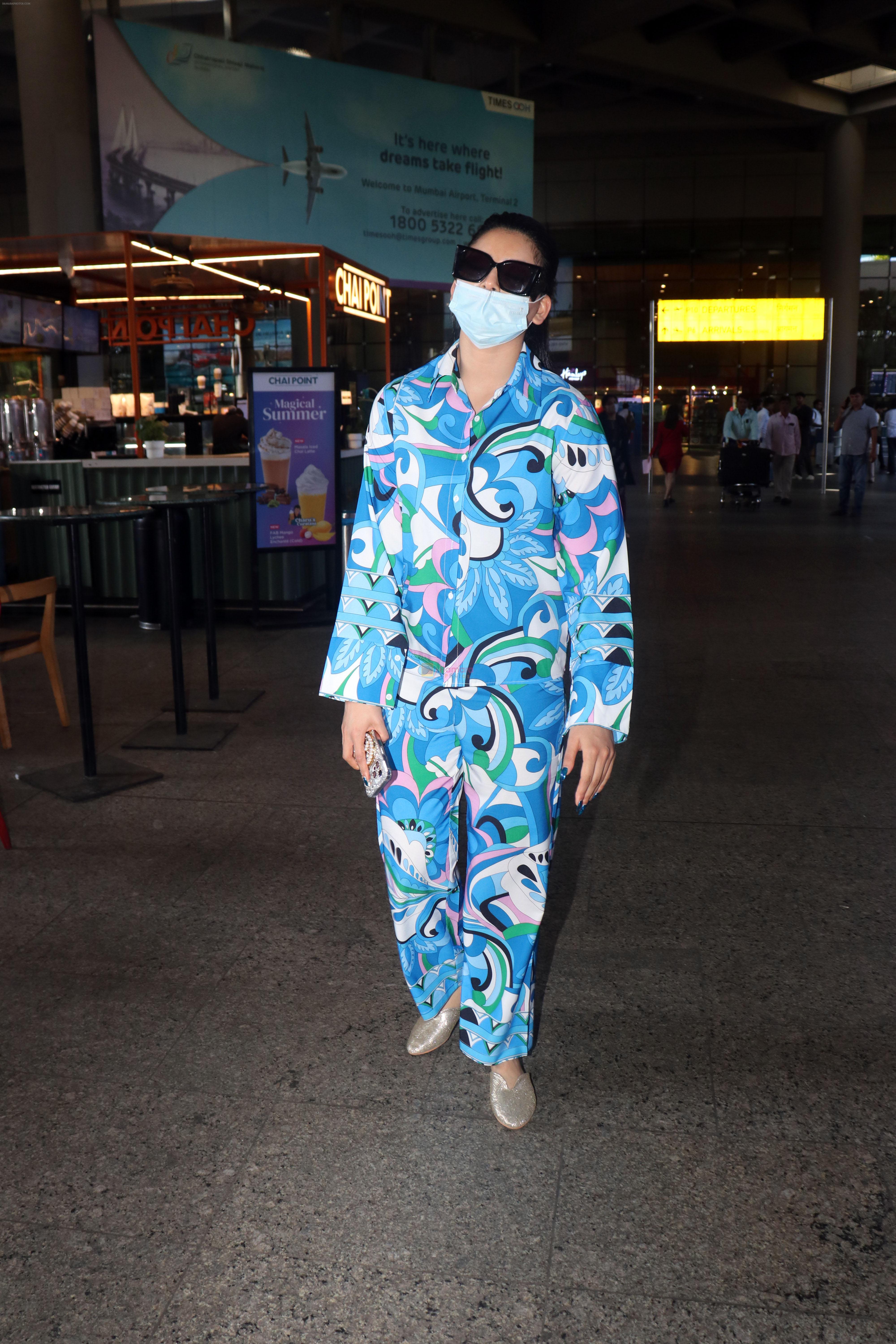 Urvashi Rautela dressed in blue night suit mask and sunglasses