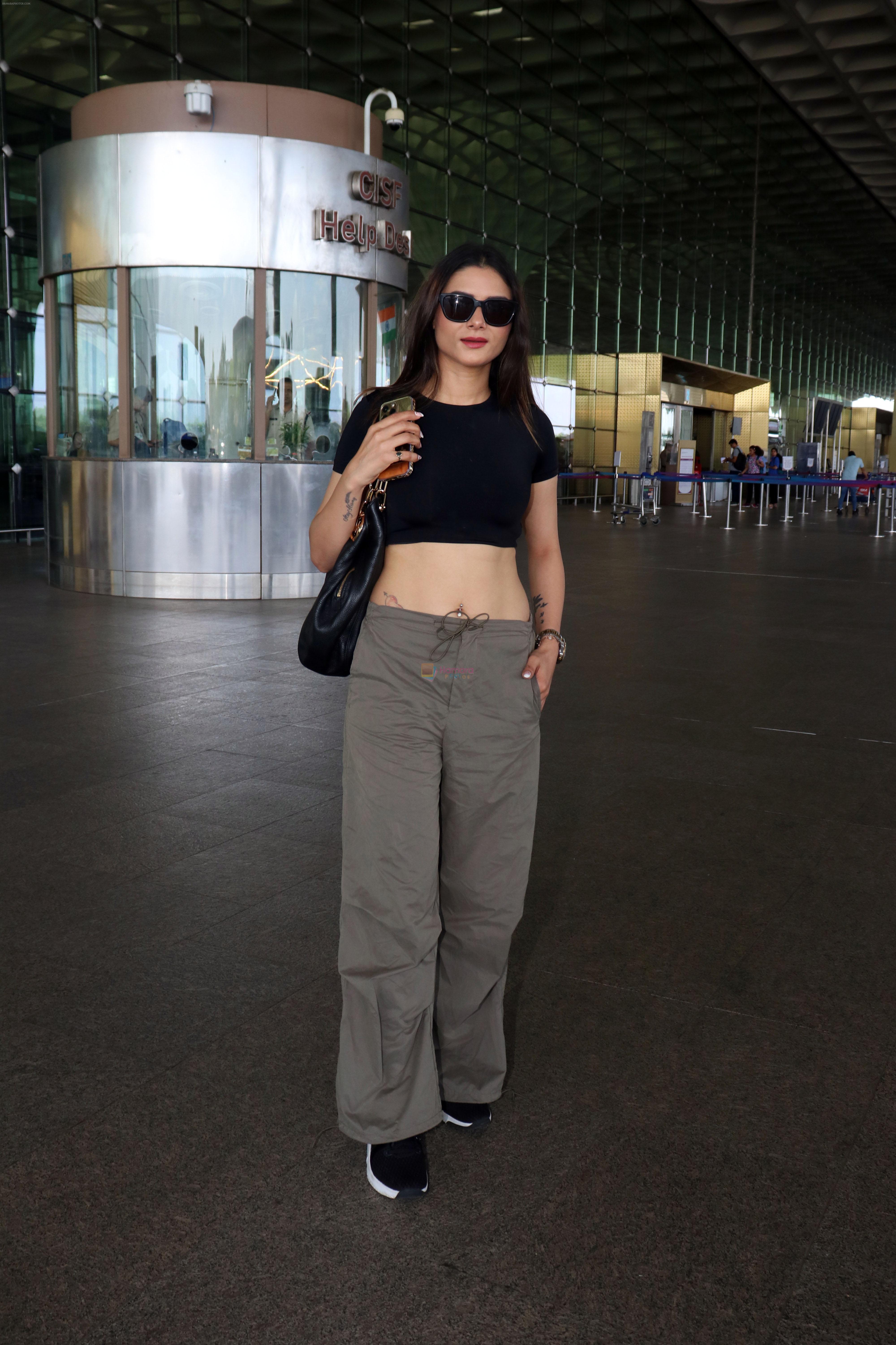 Sezal Sharma at the airport wearing black top and cargo pants