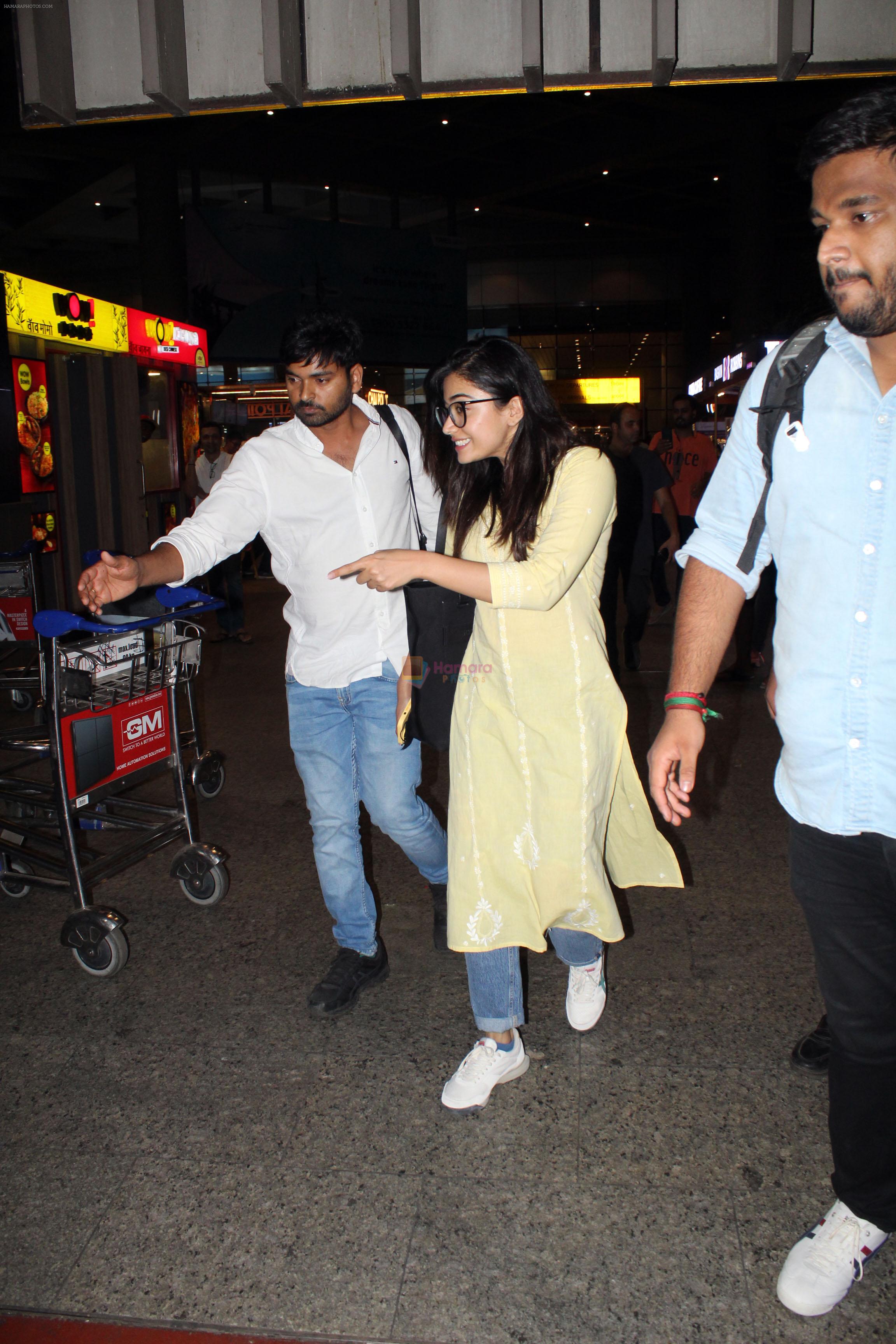 Rashmika Mandanna dressed in yellow kameez and blue jeans