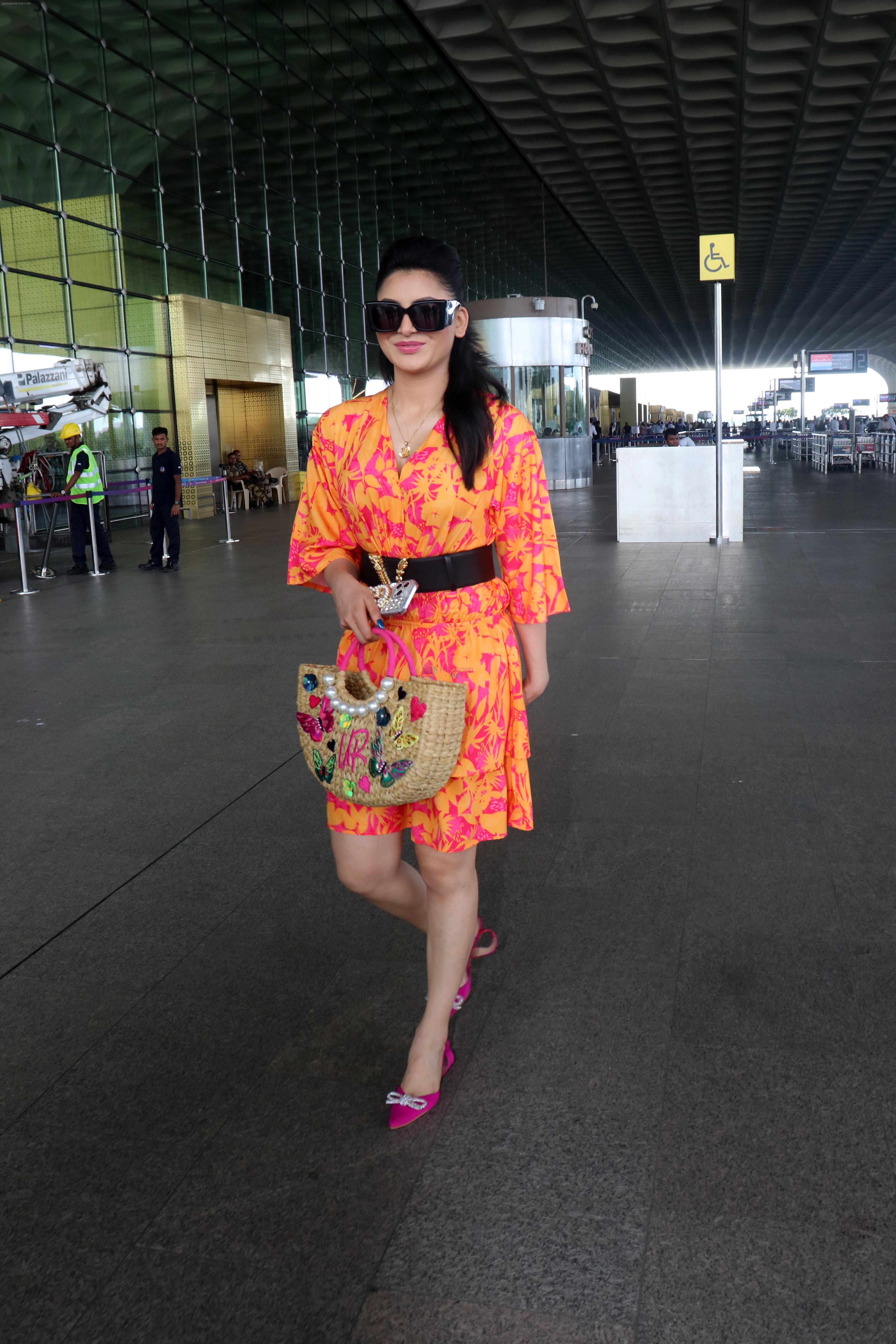 Urvashi Rautela dressed in a pink and orange floral dress spotted at airport on 14 Jun 2023