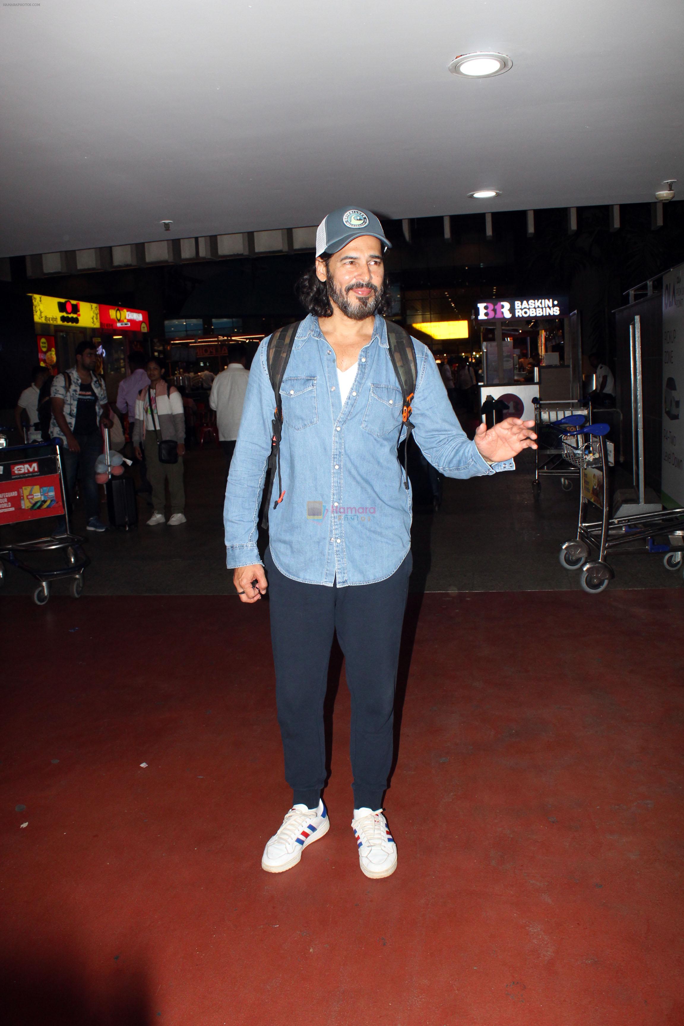 Dino Morea dressed in a jeans shirt and sweat pant with gray hat spotted at airport on 13 Jun 2023