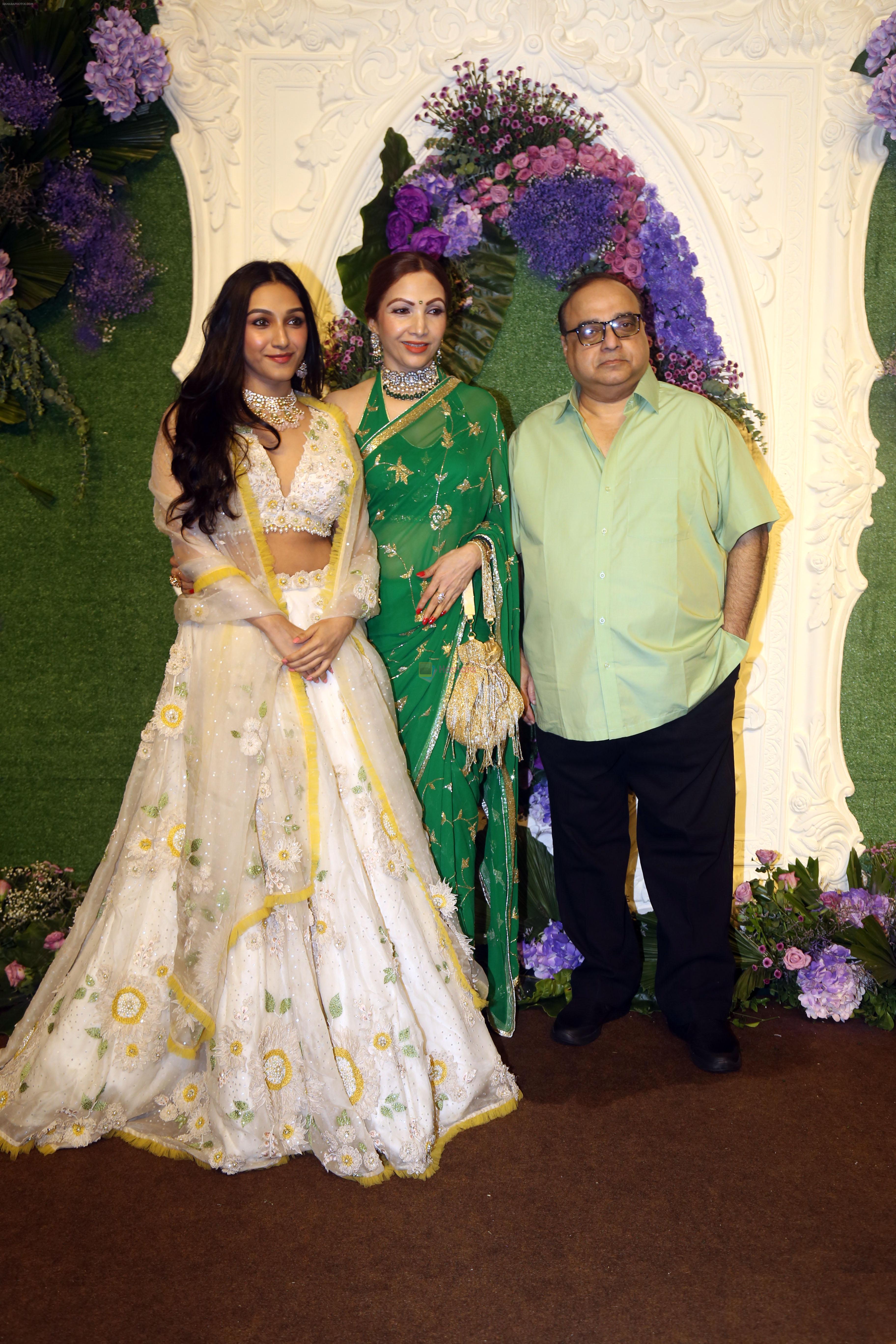 Rajkumar Santoshi with wife Manila and daughter Tanisha Pose for media at the reception of Karan Deol and Drisha Acharya on 18 Jun 2023