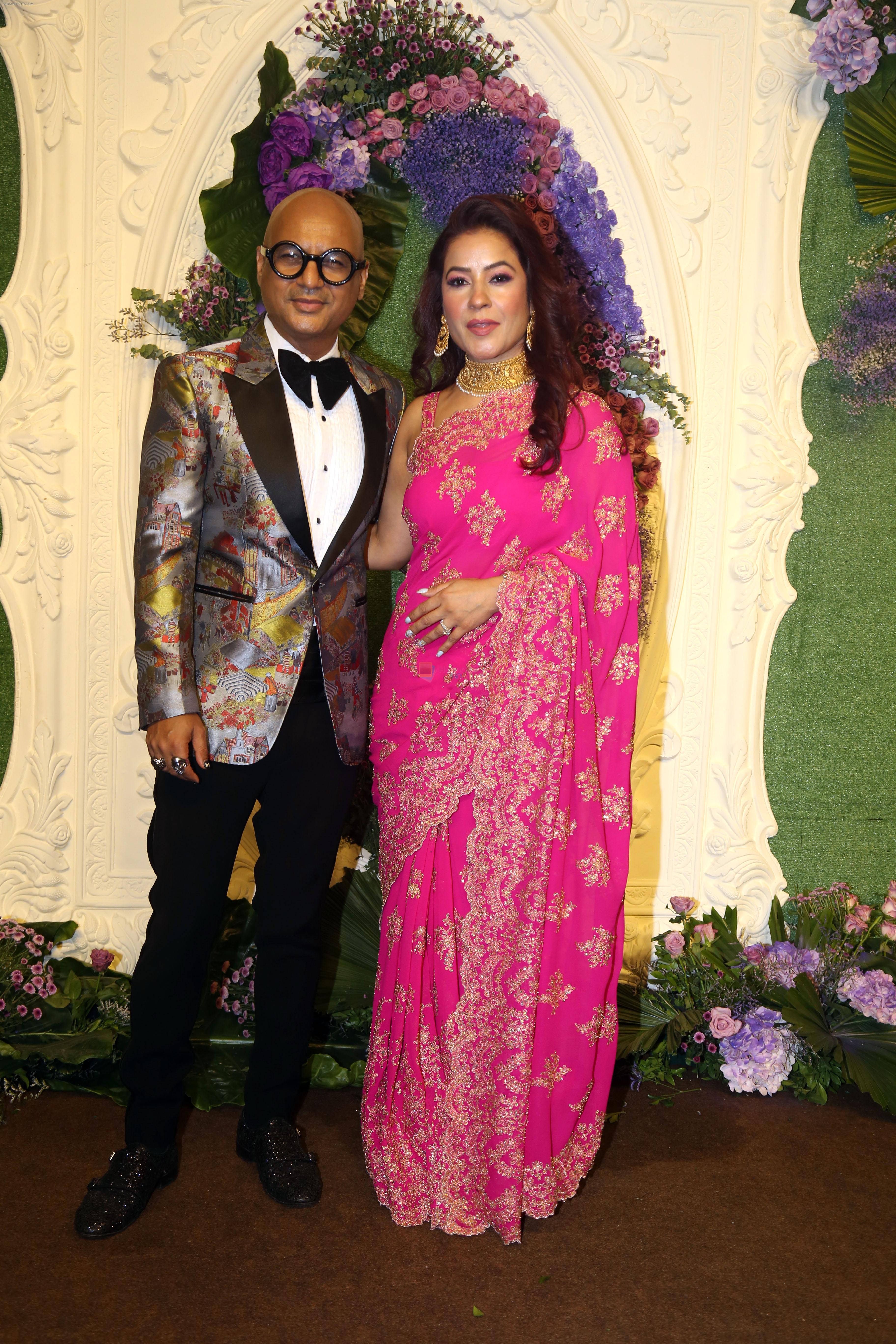Aalim Hakim with wife Shano Hanspal Pose for media at the reception of Karan Deol and Drisha Acharya on 18 Jun 2023