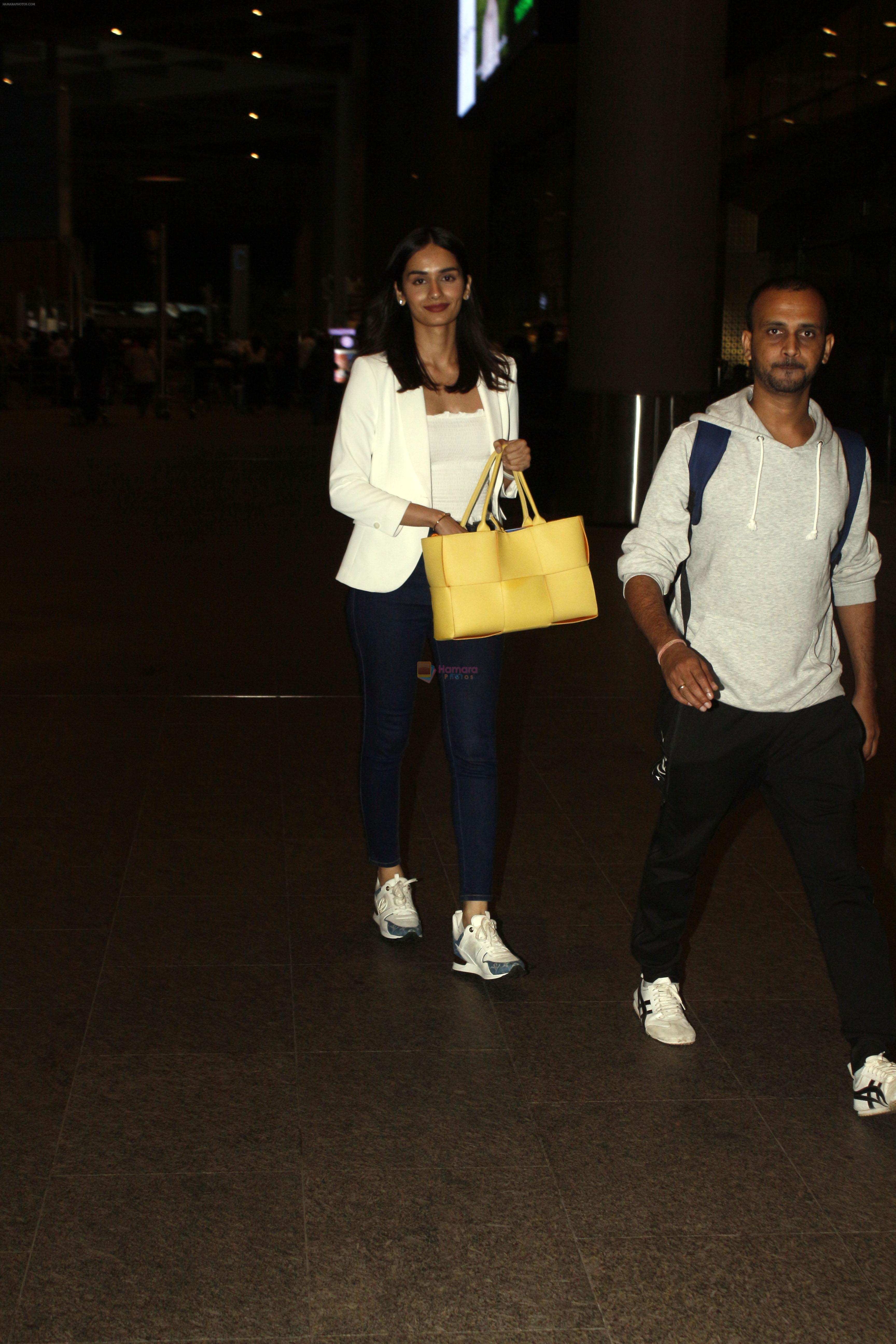 Manushi Chhillar seen in white and blue holding Bottega Veneta Handbag at the airport on 6 July 2023