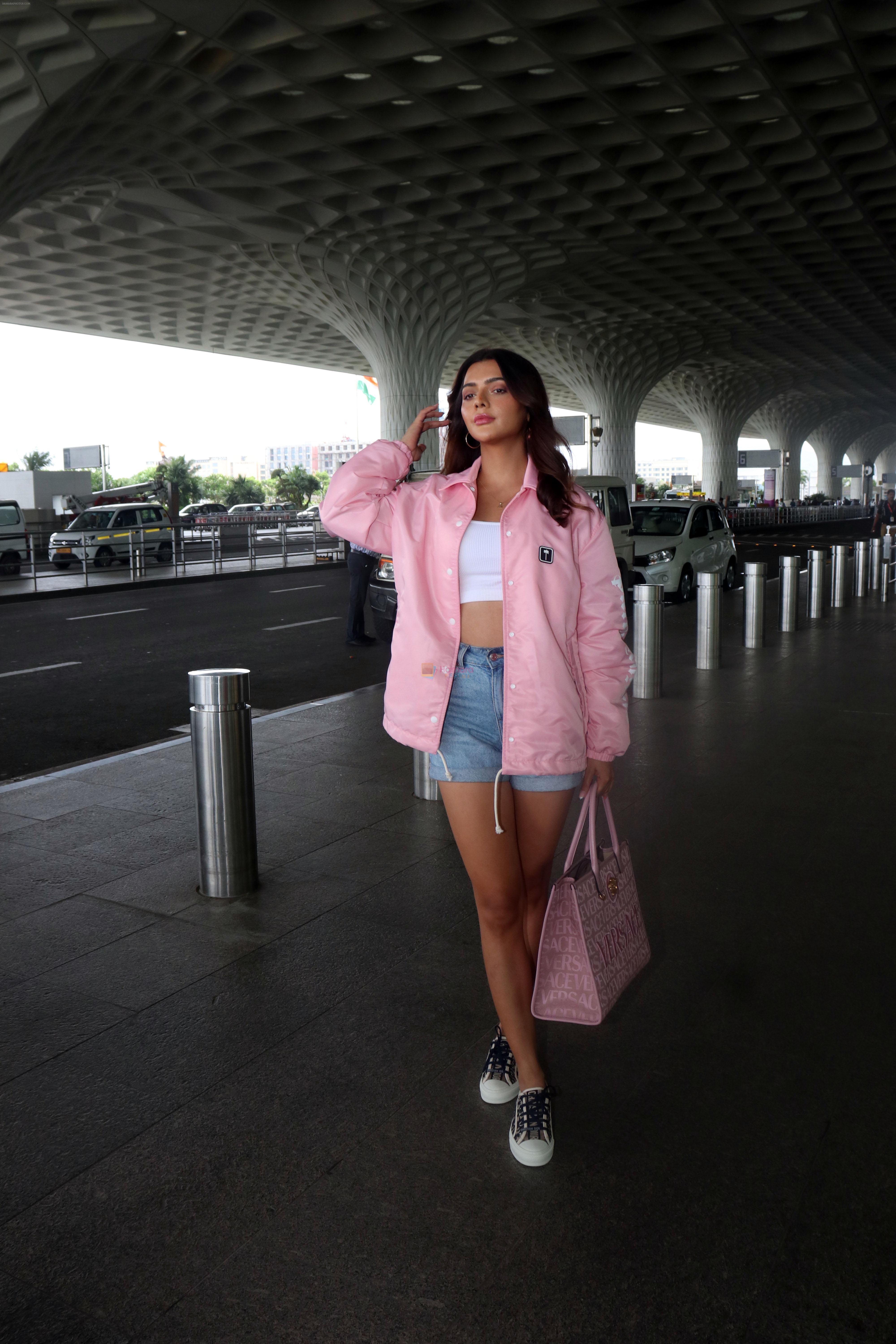 Ruhi Singh seen at the airport in pink jacket and short jeans holding versace handbag on 11 July 2023