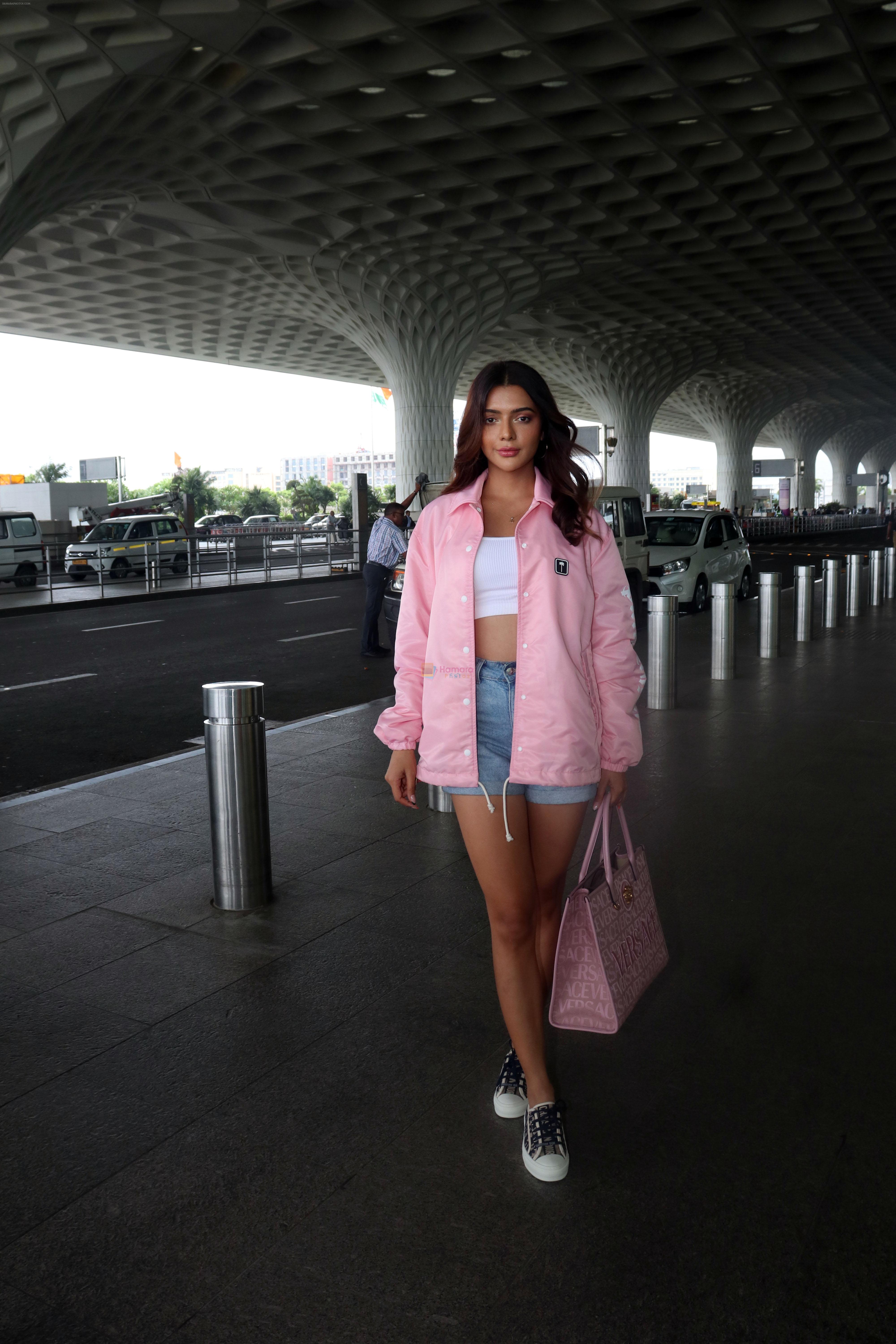 Ruhi Singh seen at the airport in pink jacket and short jeans holding versace handbag on 11 July 2023