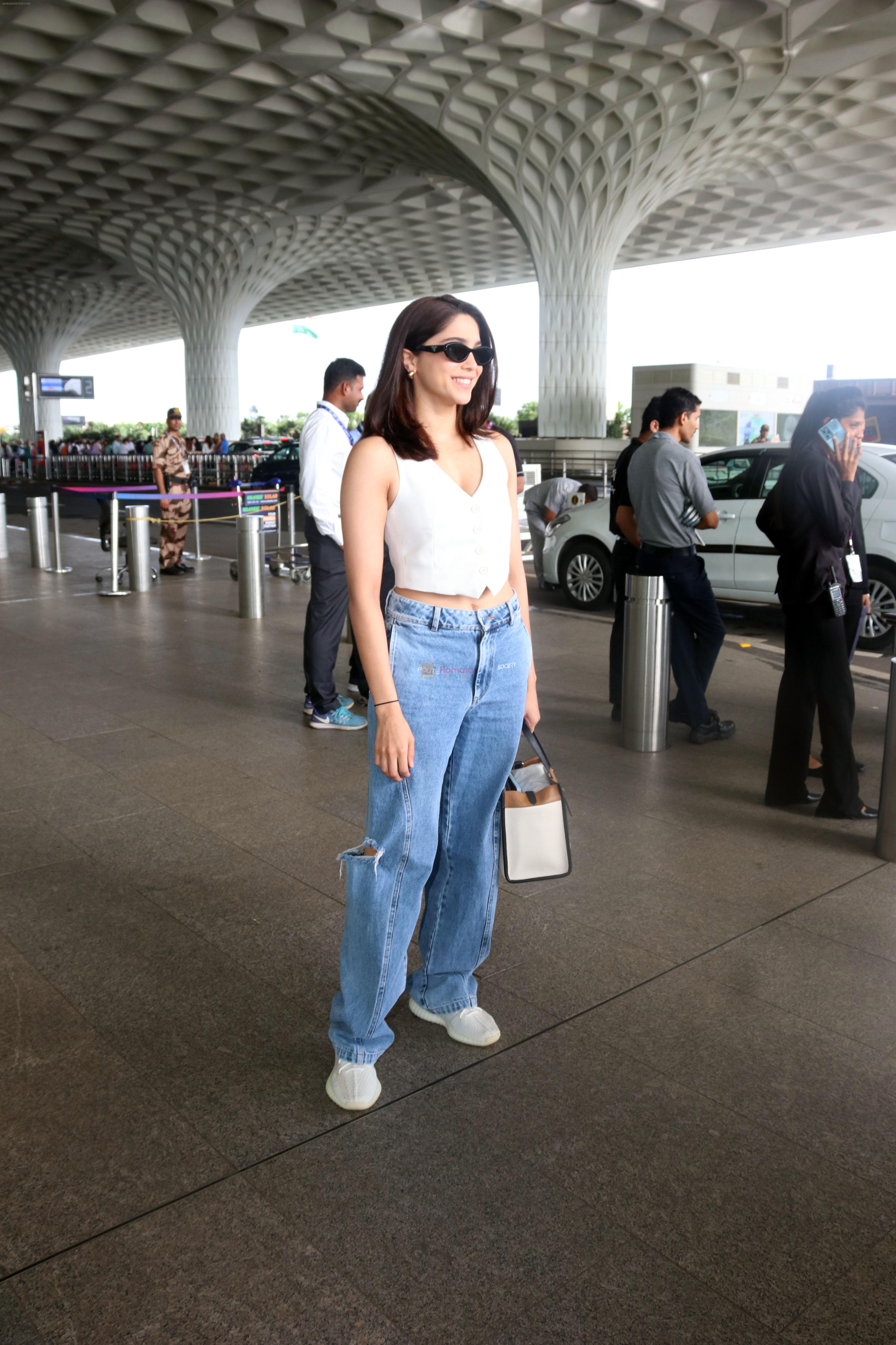 Sharvari Wagh dressed in white sleeveless top and blue jeans seen at the airport on 11 July 2023