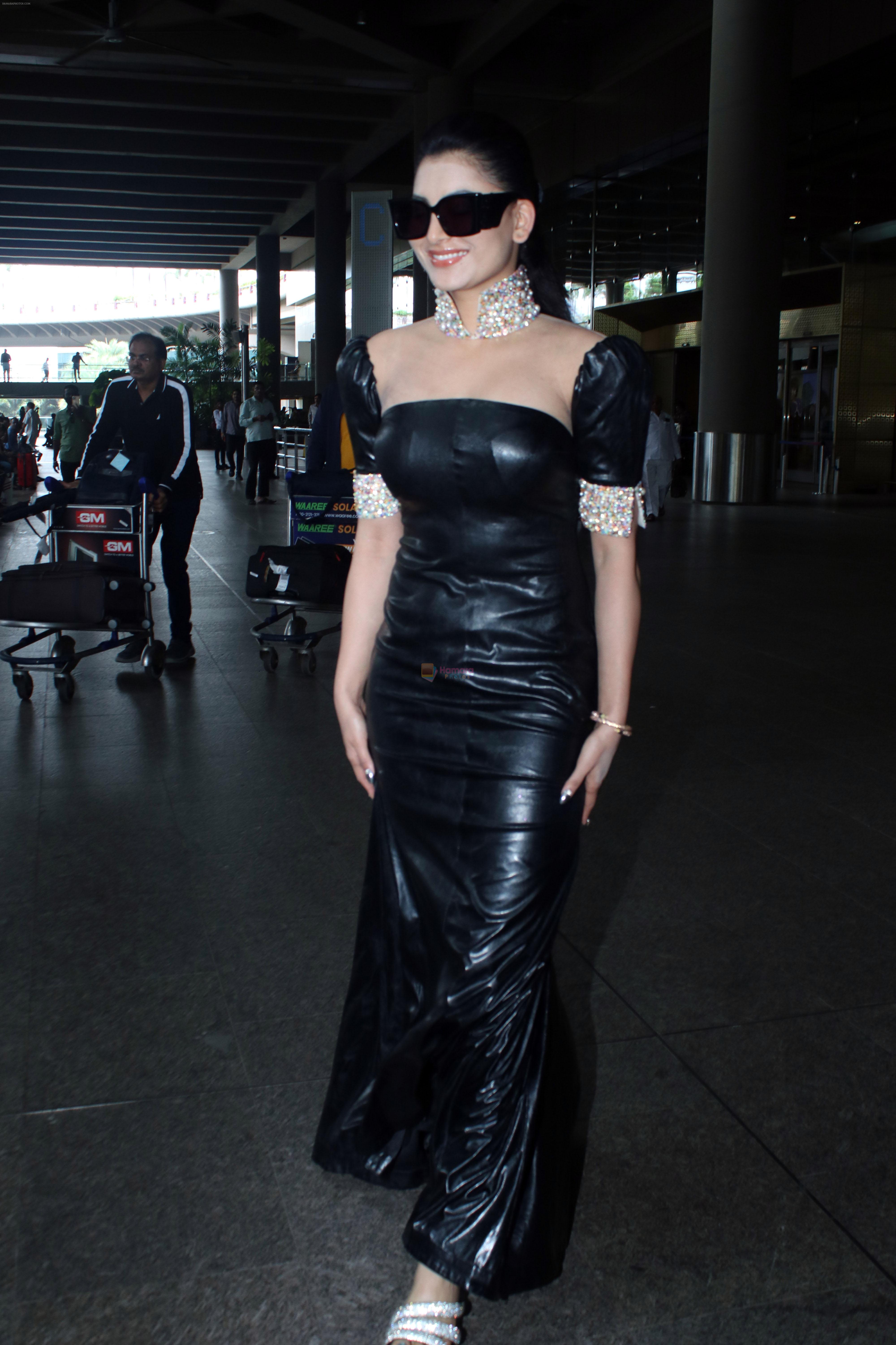 Urvashi Rautela dressed in Black seen at the airport on 13 July 2023