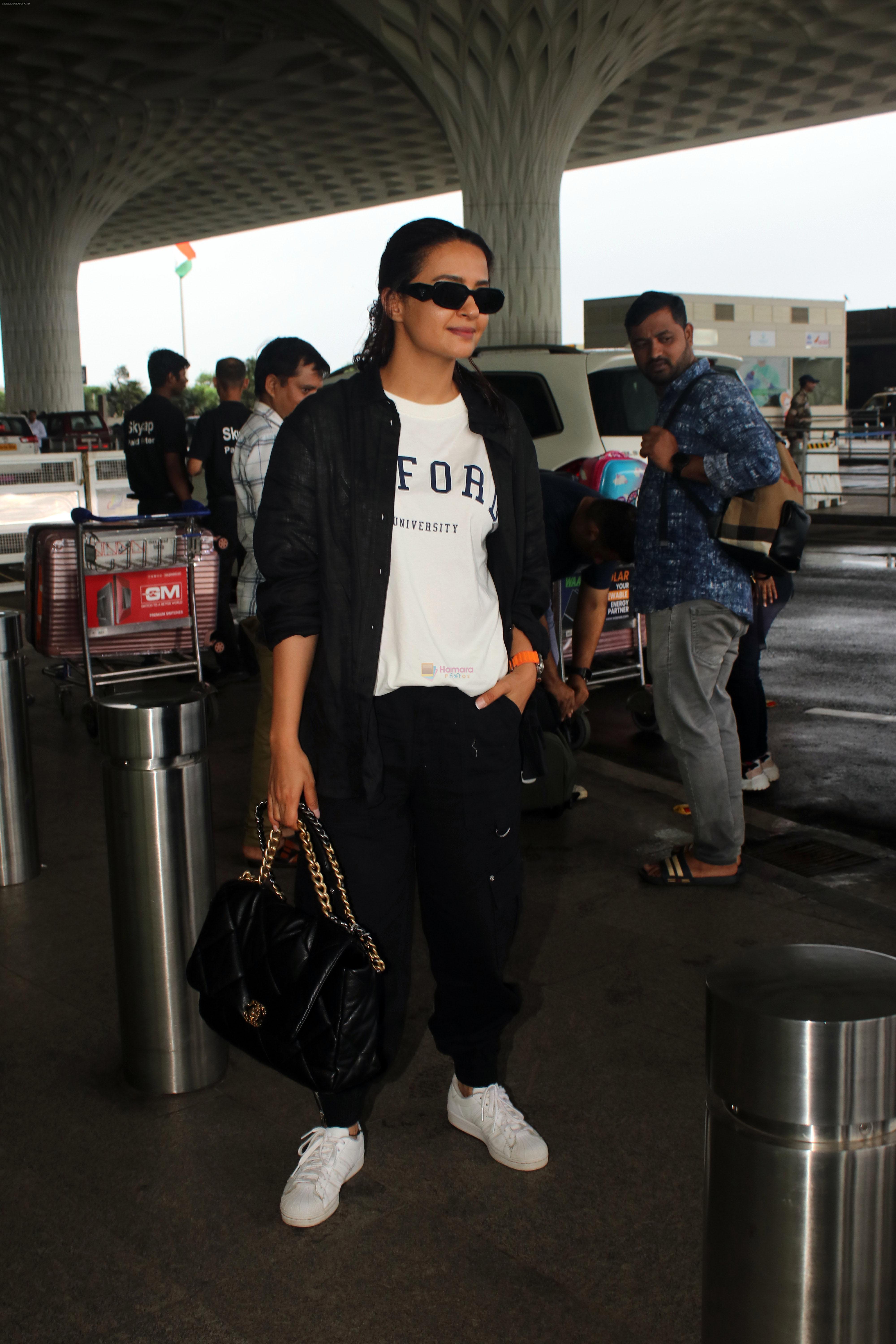Surveen Chawla seen at the airport on 18 July 2023