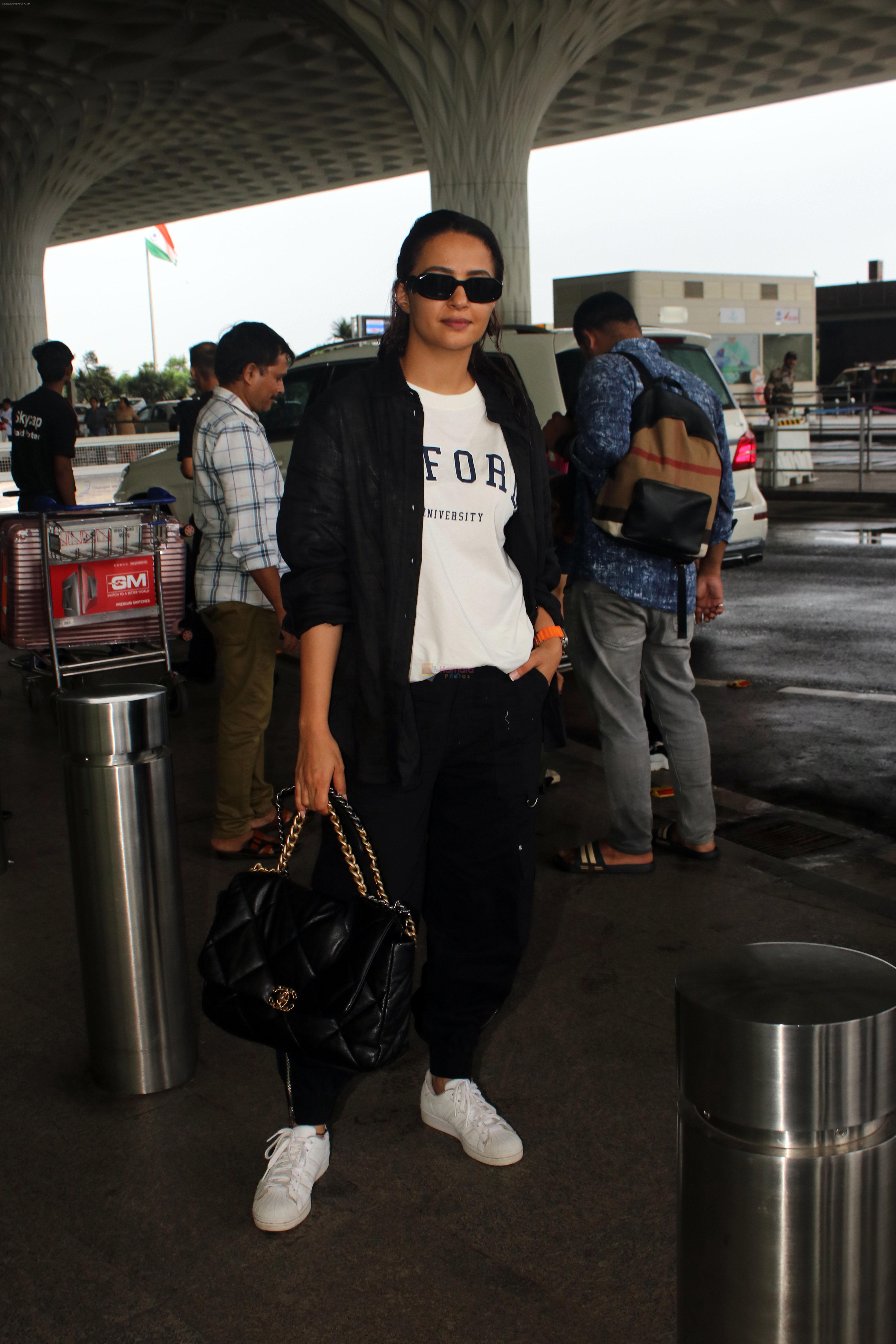 Surveen Chawla seen at the airport on 18 July 2023