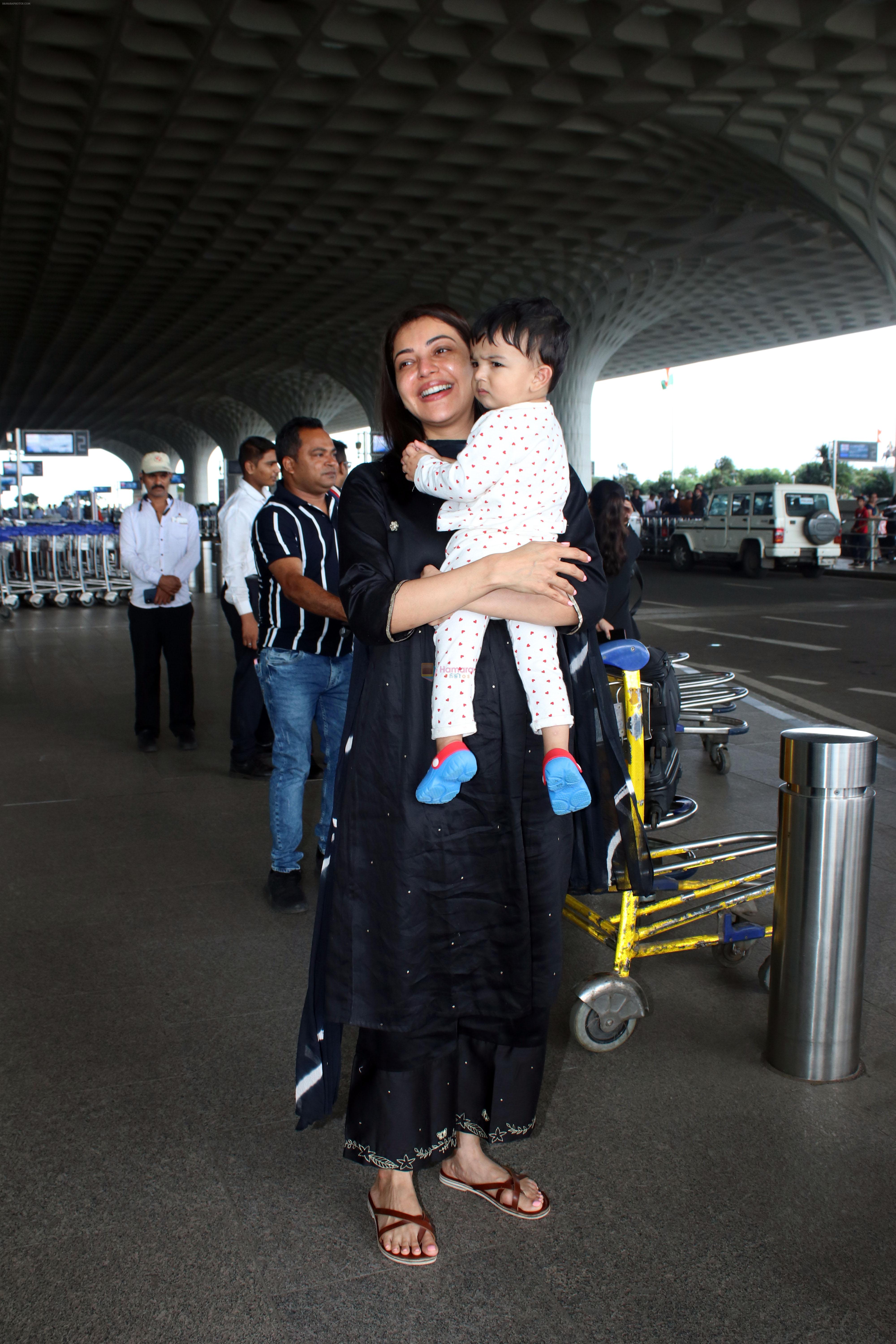 Kajal Aggarwal with her son Neil Kitchlu Spotted at the Airport Departure on 17th August 2023