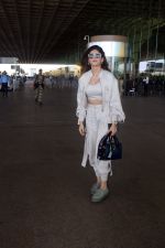 Sanjana Sanghi holding bag wearing cream colored long sleeved top and trousers and grey footwear with laces (23)_646f3f0c1f6eb.jpg