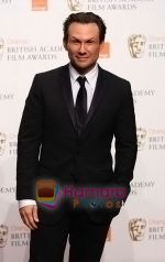 Christian-Slater-poses-at-the-winner_s-board-at-The-Orange-British-Academy-Film-Awards-held-at-the-Royal-Opera-House-on-February-8,-2009-in-London,-England.jpg