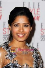 Frieda Pinto poses with her Best Actress Award at the Elle Style Awards 2009 at Big Sky Studios on February 9, 2009 in London, England (2).jpg