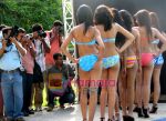 Contestants pose for photographers during the swimwear round of Dabur Gulabari Sananda Tilottama in Kolkatta on 10th June 2009 (7).jpg
