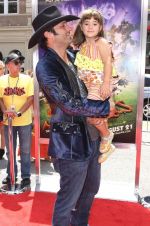 Robert Rodriguez and Rhiannon Rodriguez (1) at the Premiere Of SHORTS held at The Grauman_s Chinese Theatre in Hollywood, California, USA on Aug 15th 2009 - IANS-WENN.jpg