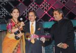 Vidya Balan accepts the award of behalf of Amitabh Bachchan from  Vishal Bhardwaj and Sanjeev Aga, MD, Idea Cellular Ltd at the 55th Idea Filmfare Awards 2009 in Mumbai on 27th Feb 2010.JPG