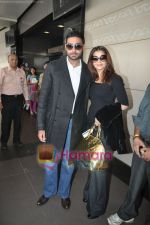 Abhishek Bachchan, Aishwarya Rai leave for london raavan premiere (6).JPG