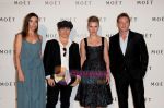 Benoit Magimel, Elodie Bouchez and director Olivier Dahan pose on the Moet red carpet with Scarlett Johansson at Moet Chandon event.JPG