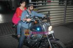 Arshad Warsi on his Harley bike with wife Maria as they went to watch The King_s Speech on 8th March 2011 (2).JPG
