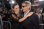 Olivia Wilde and Harrison Ford arrives at the world premiere of the movie Cowboys and Aliens at San Diego Civic Theatre on July 23, 2011 in San Diego, California.jpg
