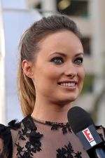 Olivia Wilde arrives at the world premiere of the movie Cowboys and Aliens at San Diego Civic Theatre on July 23, 2011 in San Diego, California (6).jpg