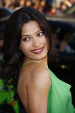 Freida Pinto attends the LA Premiere of the movie Rise Of The Planet Of The Apes on 28th July 2011 at the Grauman_s Chinese Theatre in Hollywood, CA  United States (18).jpg