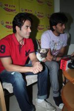 Ritesh Deshmukh, Tusshar Kapoor with dog Macho on the sets of Radio Mirchi to promote Kya Super Kool Hain Hum in Lower parel, Mumbai on 25th June 2012 (28).JPG