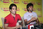 Ritesh Deshmukh, Tusshar Kapoor with dog Macho on the sets of Radio Mirchi to promote Kya Super Kool Hain Hum in Lower parel, Mumbai on 25th June 2012 (55).JPG