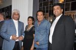 Vinod Khanna with Rakesh and Ramit Mittal at Pizza Express launch in Colaba, Mumbai on 19th Dec 2012.JPG