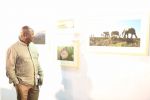 Consul General of South Africa Mr. Pule Malefane exploring the photography exhibition on South Africa by renowned photographer Sudharak Olwe.JPG