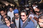 Shahrukh Khan, Abhishek Bachchan, Shahid Kapoor arrive from IIFA awards 2013 in Mumbai Airport on 7th July 2013 (91).JPG