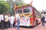 Abhishek Bachchan flags off 2 BEST buses along with Mayor of Mumbai Sunil Prabhu and Yuva Sena President Aditya Thackrey in Mayor_s Bungalow on 8th July 2013 (18).JPG
