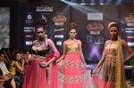 Models pose for the camera wearing a design of Seema Singh at the Signature Premier Pune Style Week..JPG