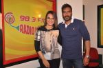 Sonakshi Sinha & Ajay Devgn at Radio Mirchi Mumbai studio for the promotion of upcoming movie Action Jackson (3)_547ea48f51013.JPG